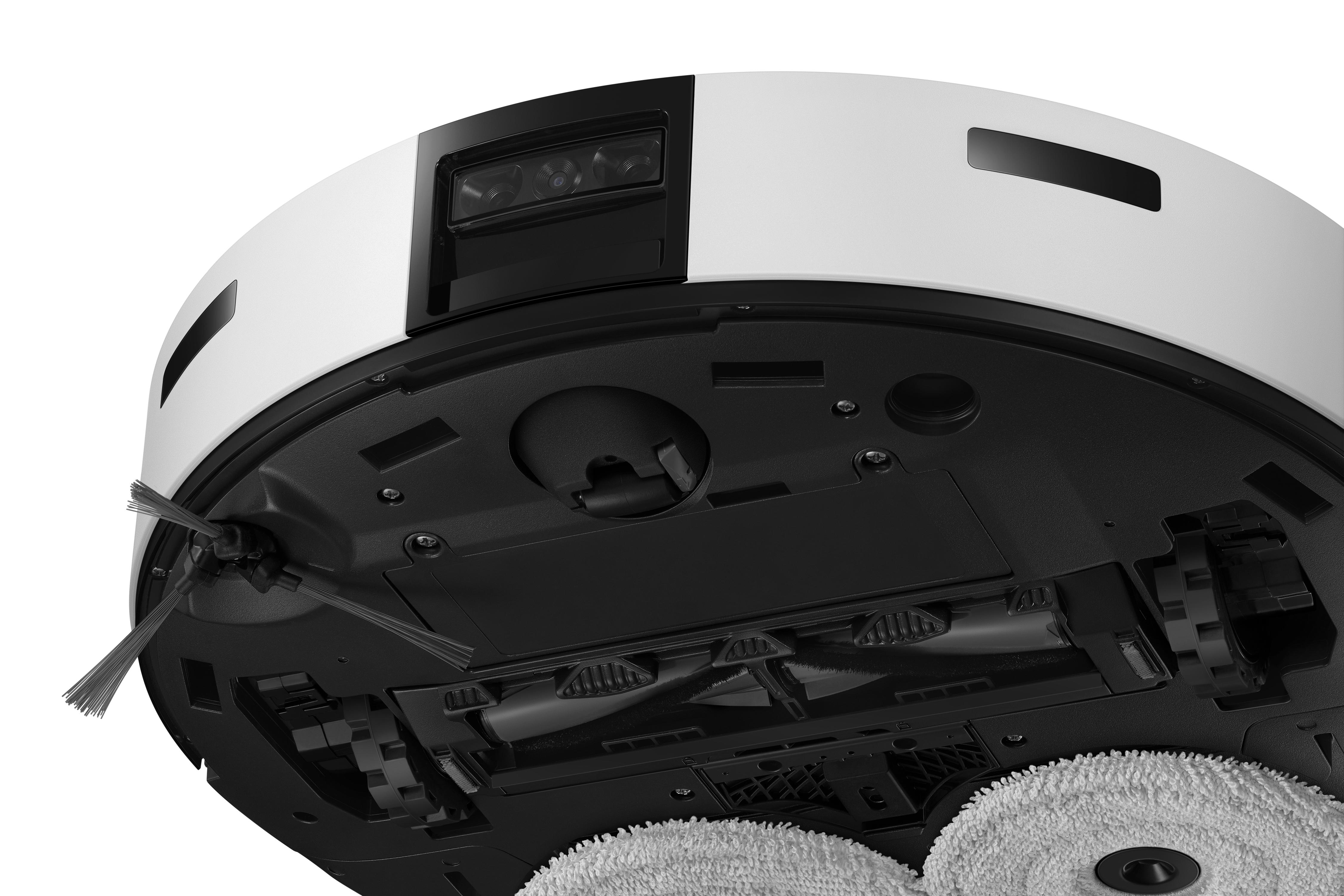 Unterseite eines weißen und schwarzen Roboter-Staubsaugers mit Bürsten, Rädern und Reinigungskomponenten.