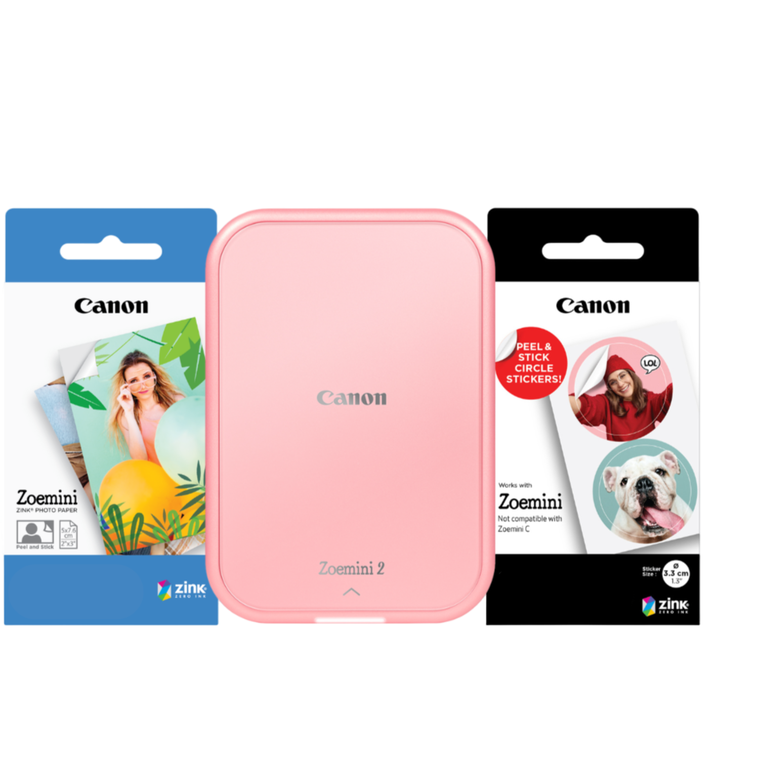 Pink Canon Zoemini 2 printer with photo paper and sticker packs. White background.