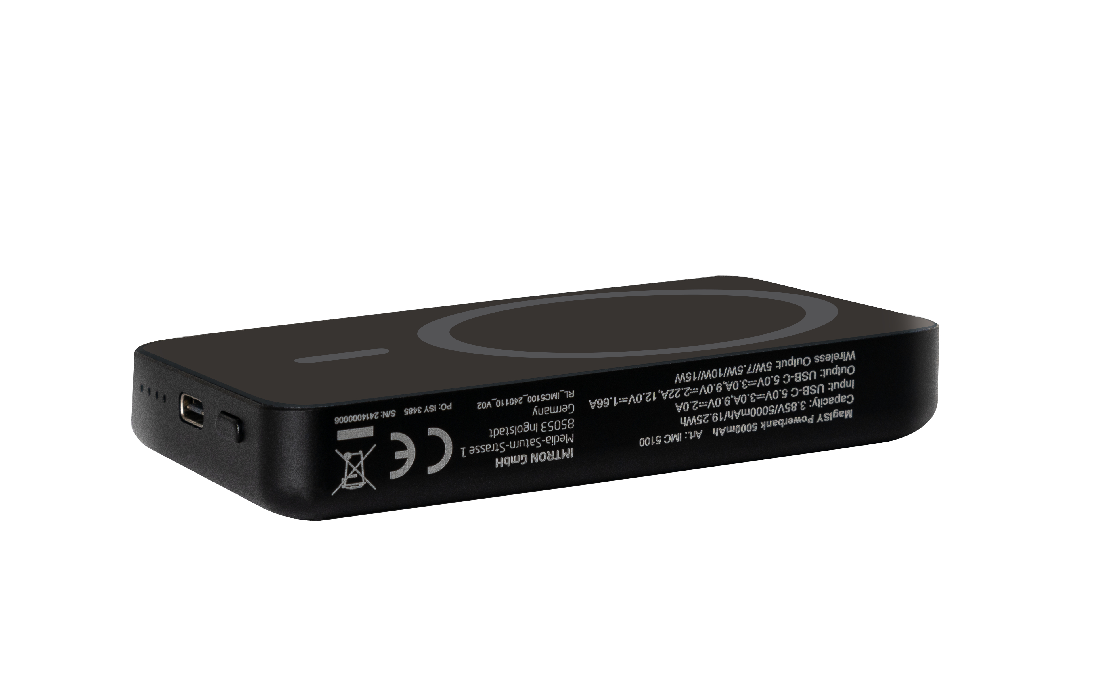 Schwarze Powerbank mit kreisförmiger Ladefläche und USB-Anschlüssen.
