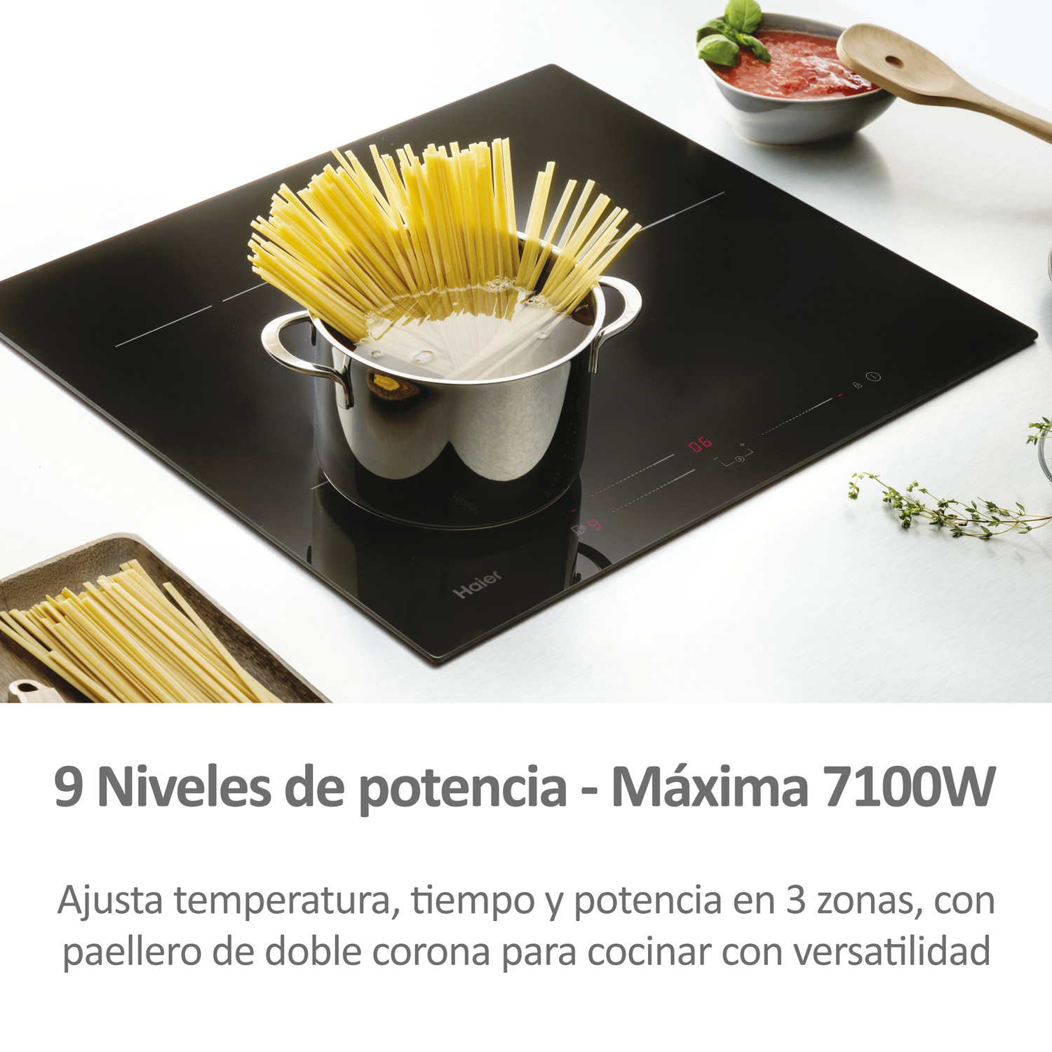 Placa de cocina negra con una olla de pasta. Texto: 9 Níveis de potencia - Máxima 7100W.