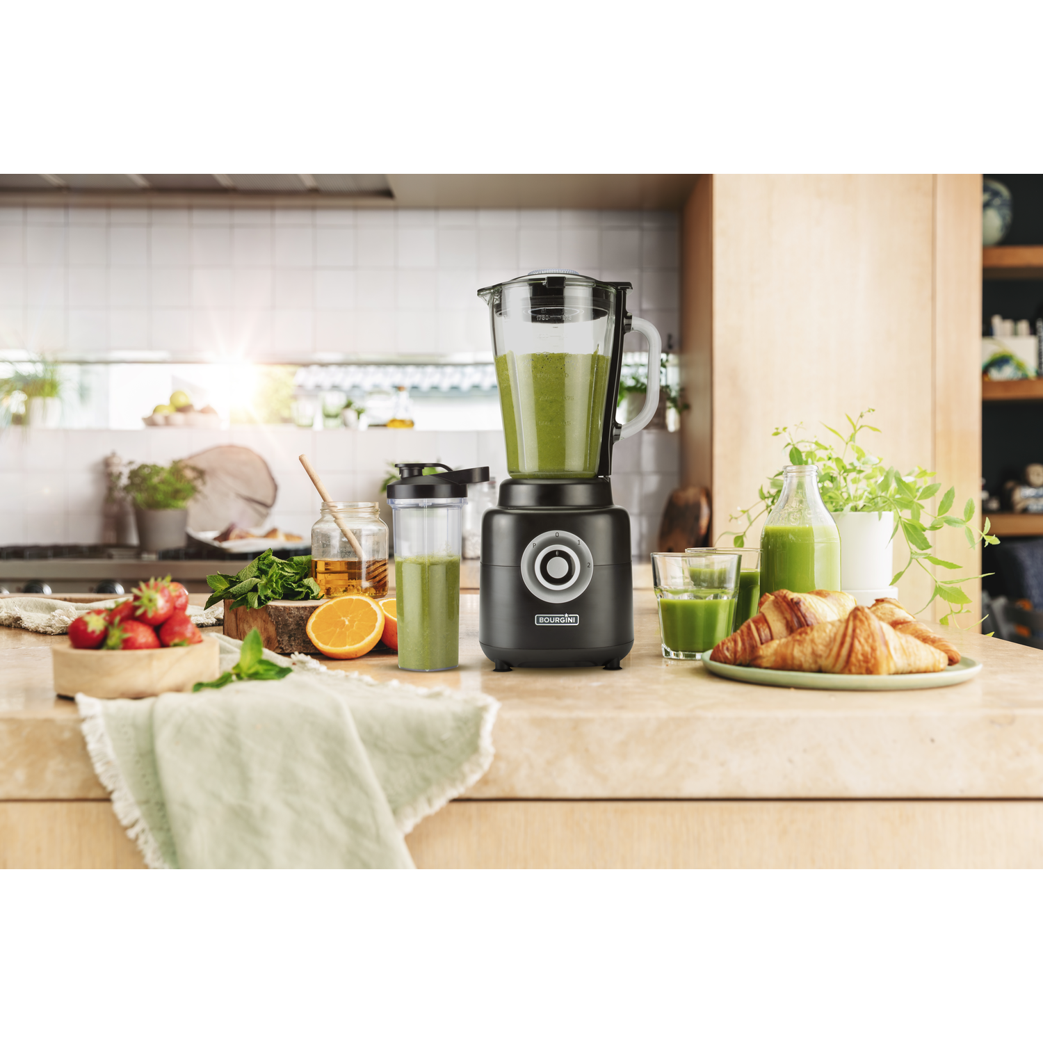 A kitchen scene with blender, smoothie, and breakfast items on a counter.