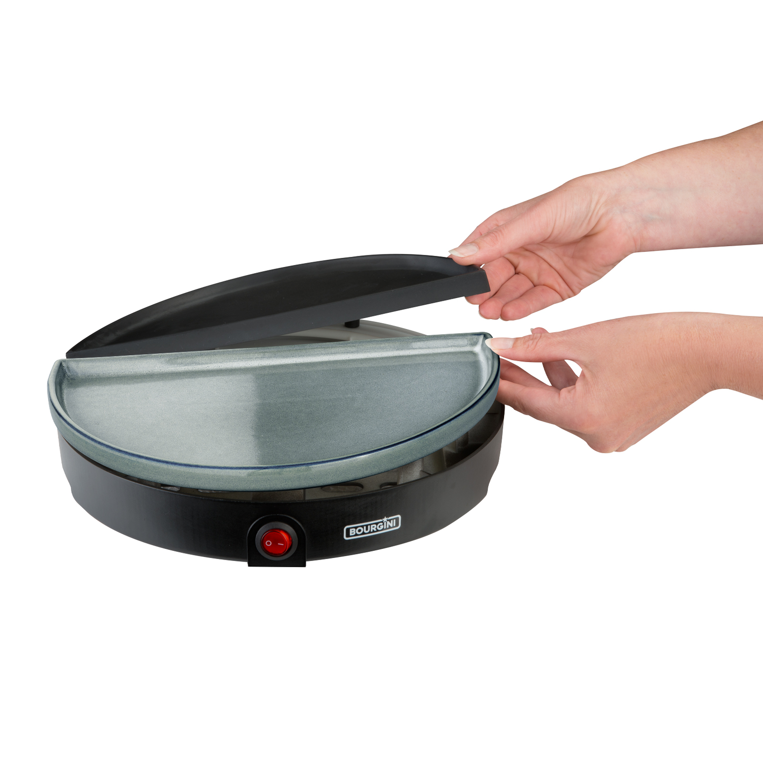 A woman's hands opening a black and gray crepe maker machine.