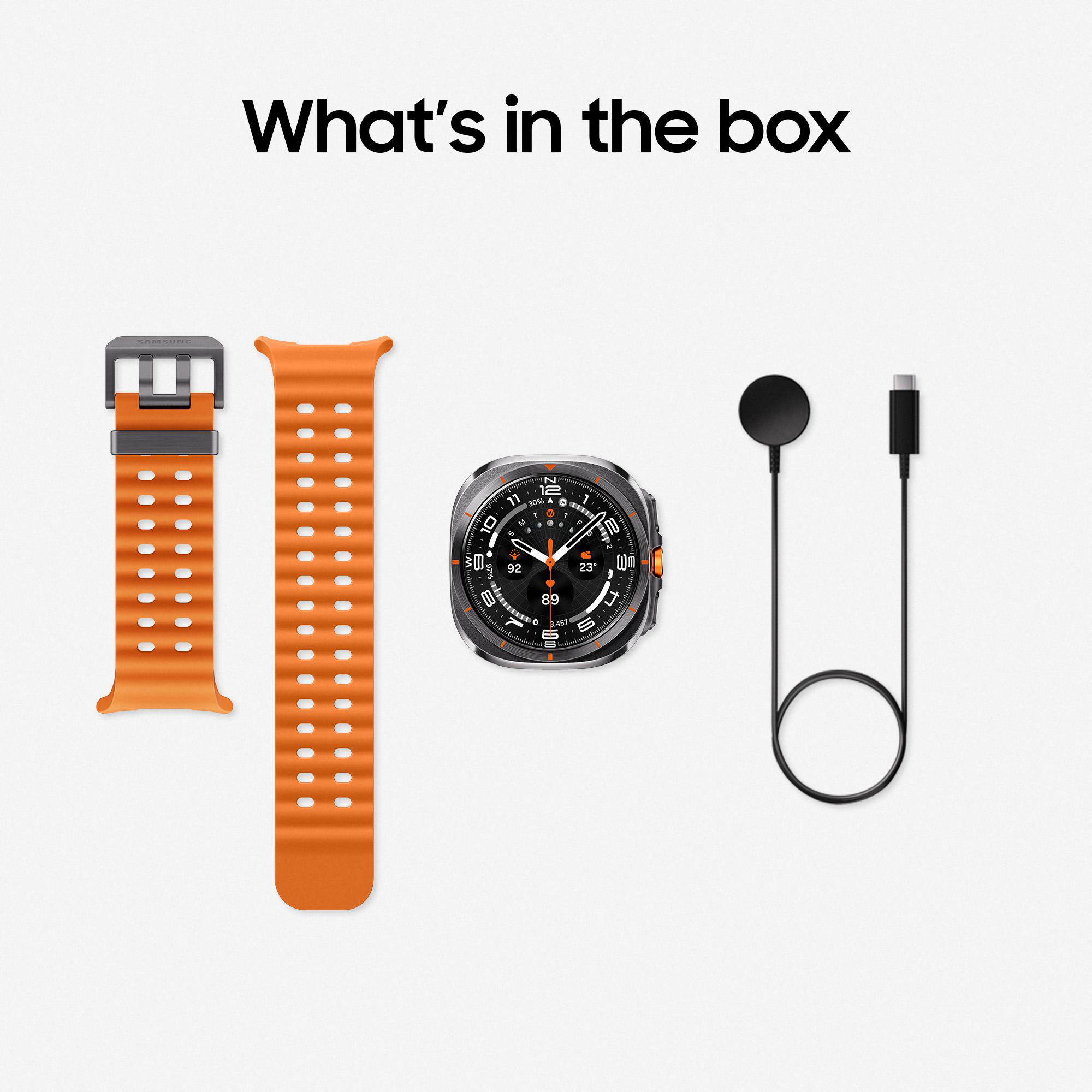 Orangefarbene Armbänder, Uhr, Ladegerät und Kabel auf weißem Hintergrund. Text: Was ist in der Box.