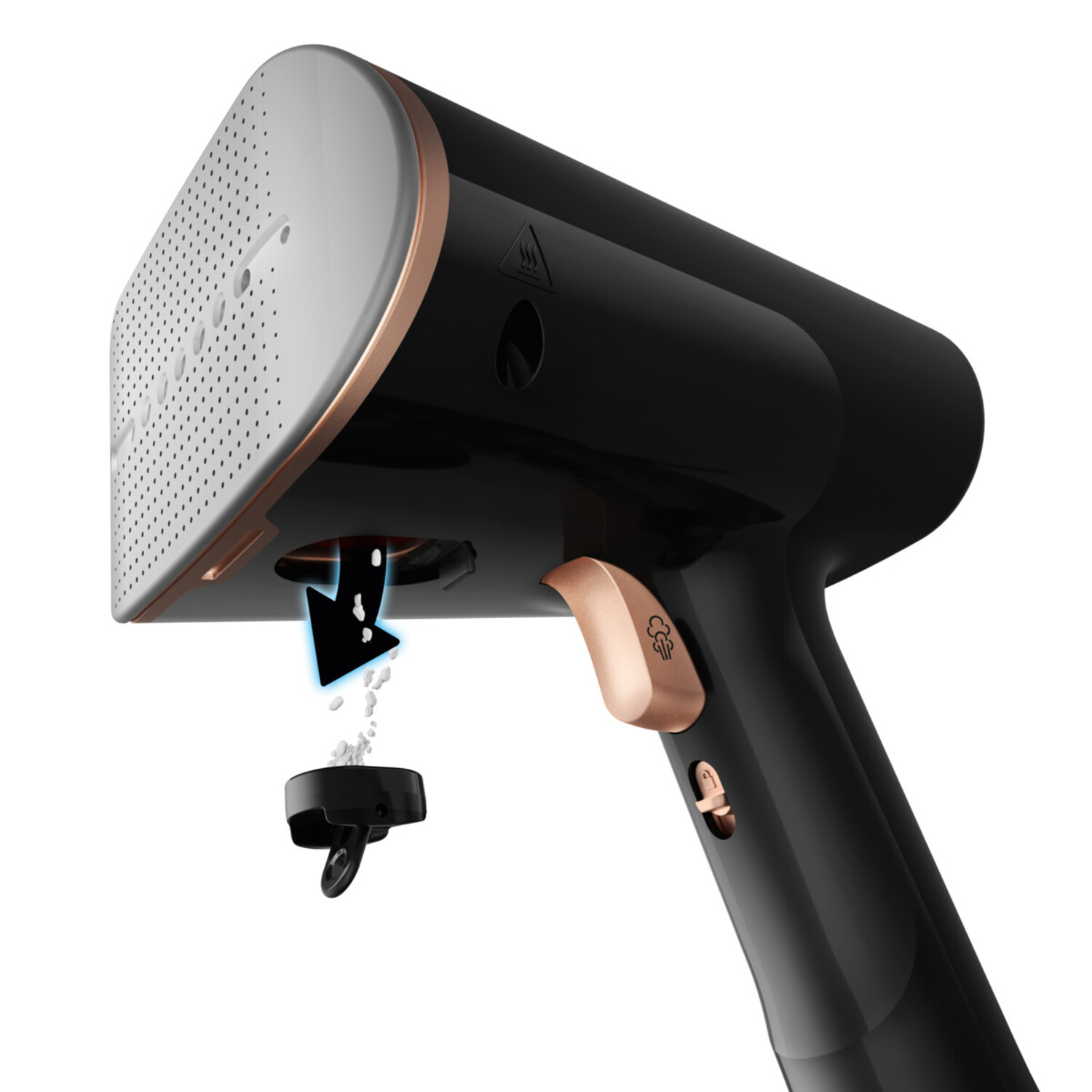A black and copper-colored handheld steamer, with water being poured out.