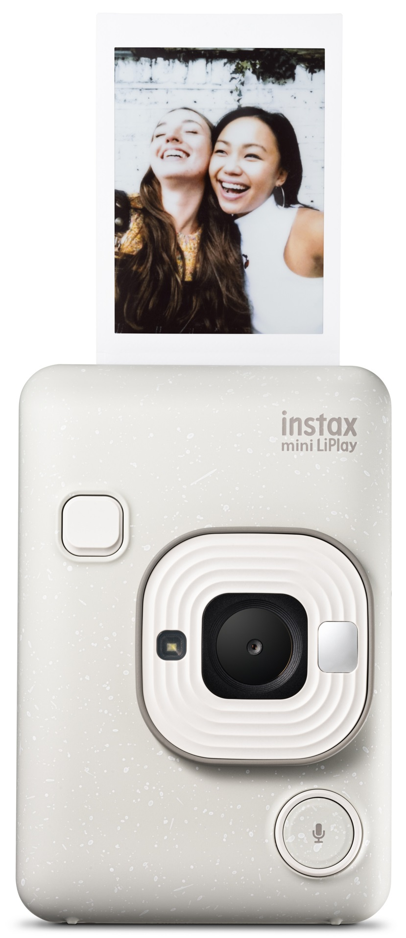 Biały aparat drukuje zdjęcie dwóch uśmiechniętych kobiet. Aparat znajduje się na białej powierzchni.
