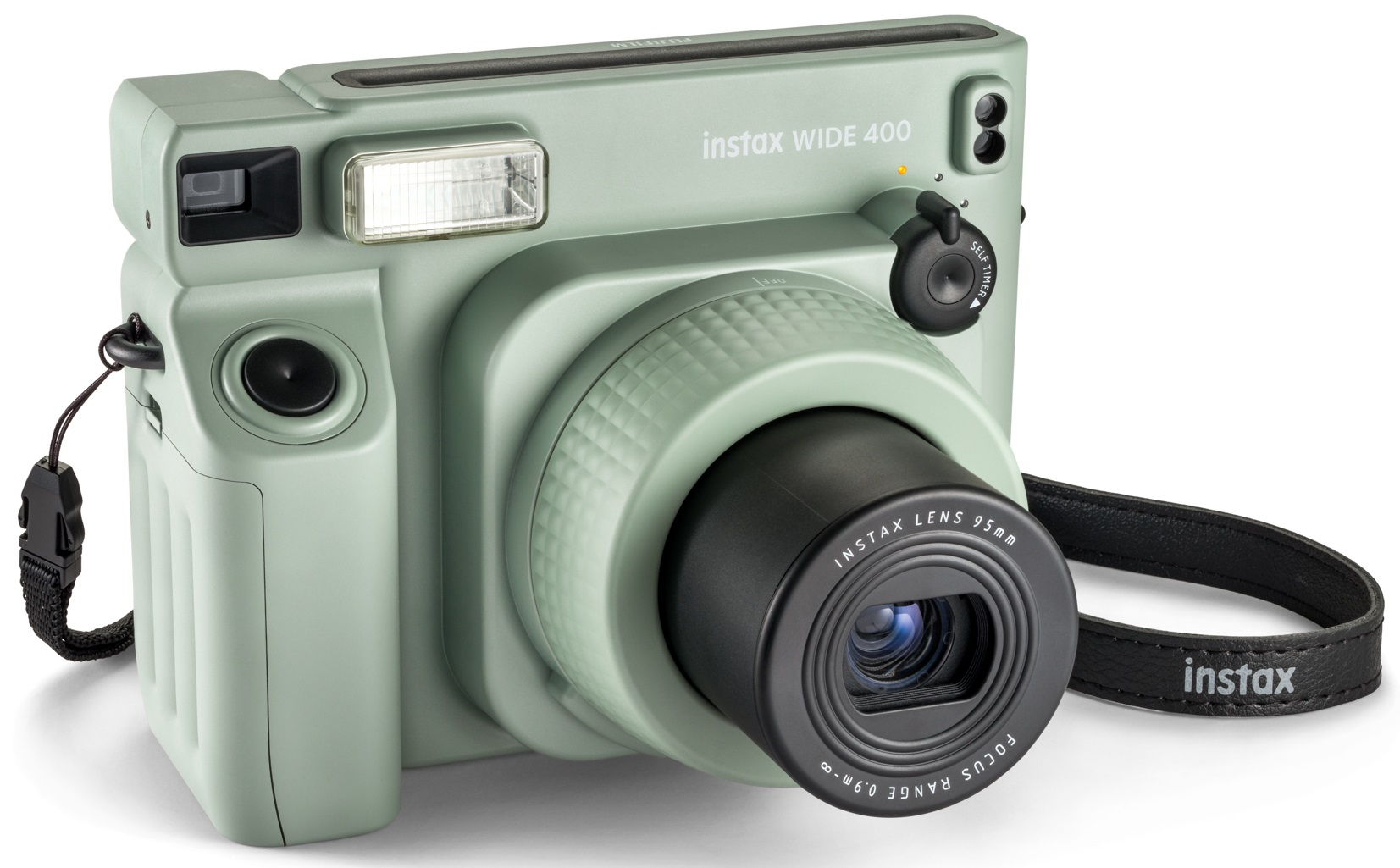 Zielony aparat natychmiastowy z czarnym obiektywem, lampą błyskową i czarnym paskiem.