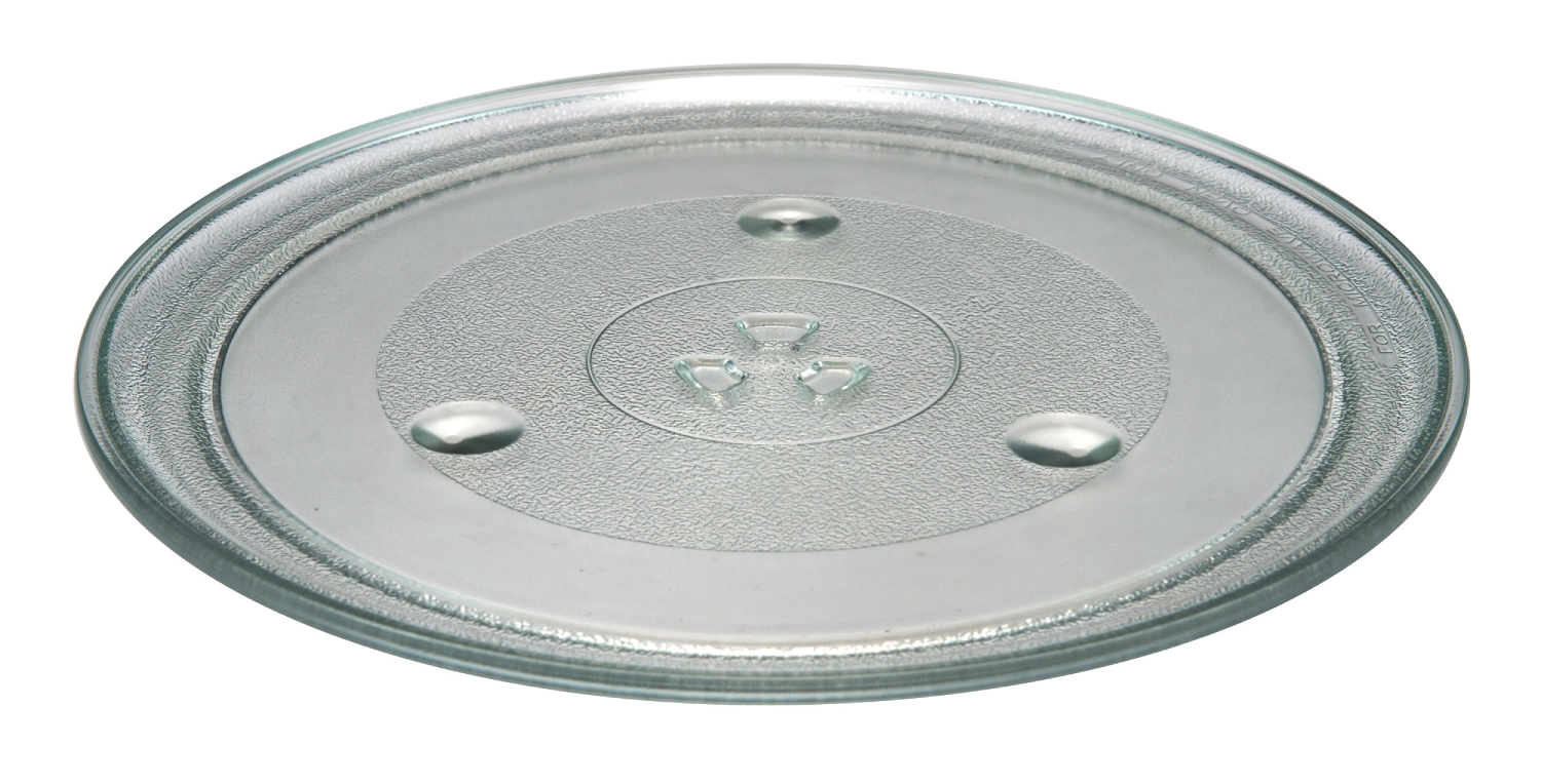 Plato de microondas de vidrio transparente con diseño circular y áreas elevadas para soporte.