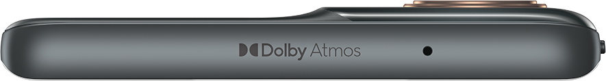 Egy telefon szélének közeli képe. Dolby Atmos logó és egy kis mikrofon lyuk látható.