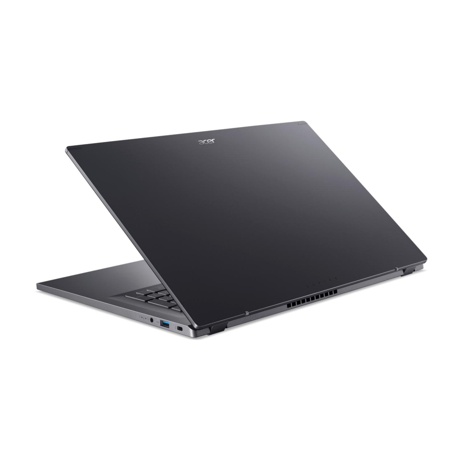 A dark gray laptop is slightly open, showing the keyboard and screen. The Acer logo is visible. The background is black.