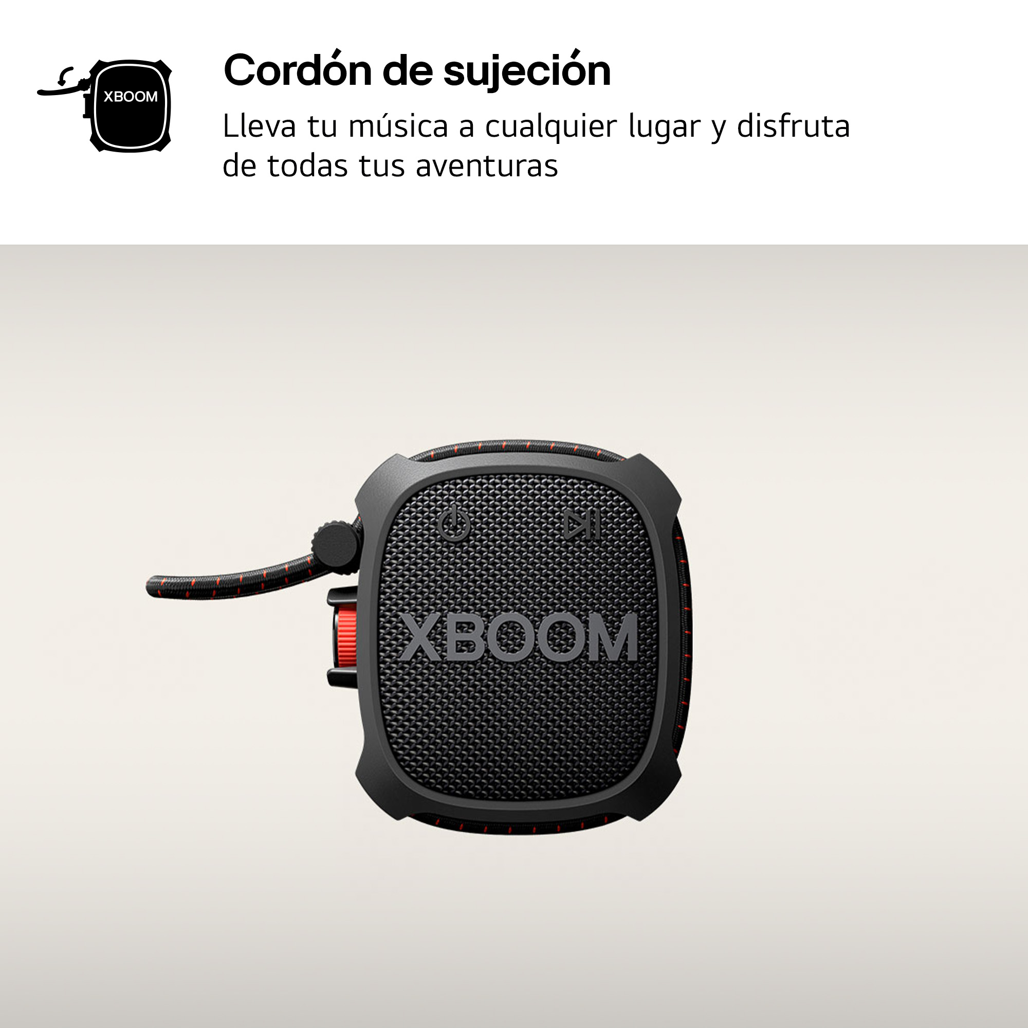 Un altavoz portátil negro con una correa de transporte, con texto en español.
