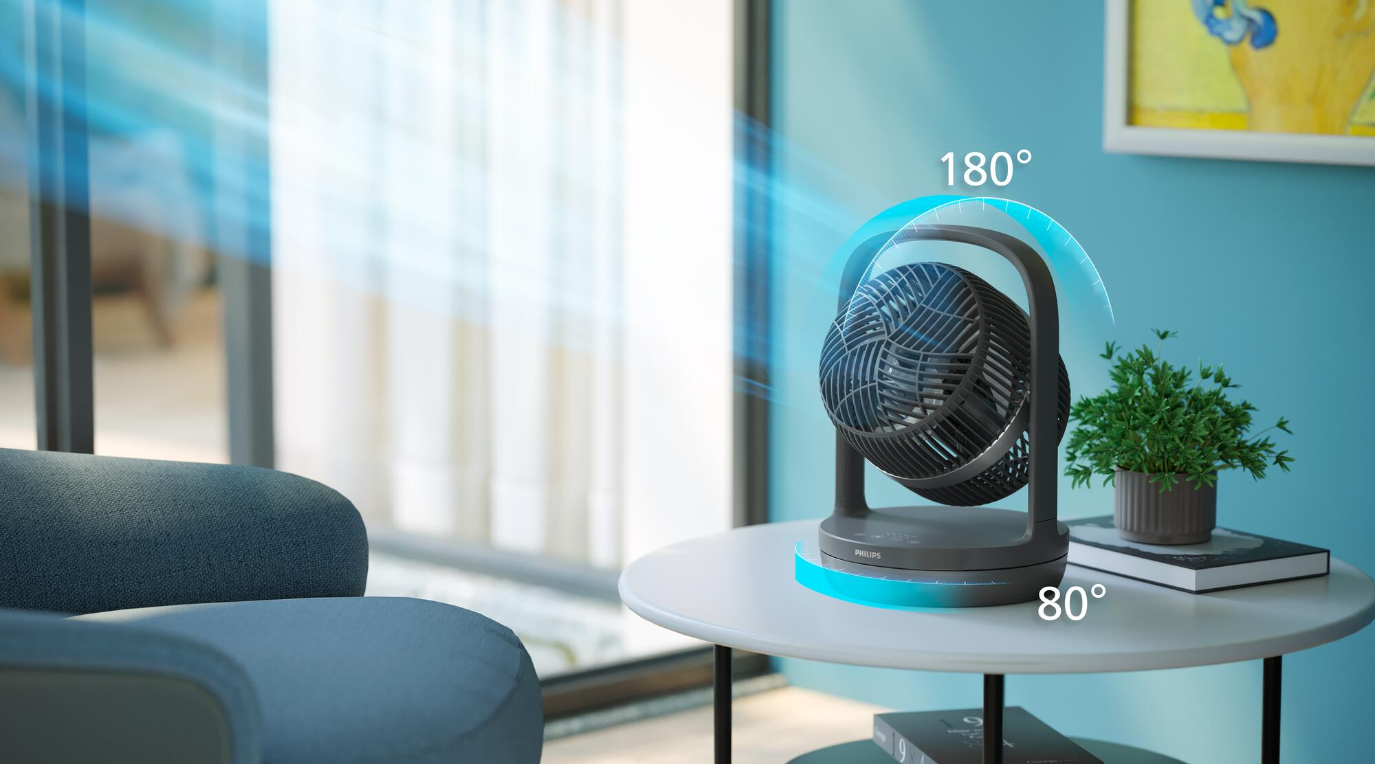 Un ventilador gris oscuro sobre una mesa blanca con efecto de brillo azul y texto.