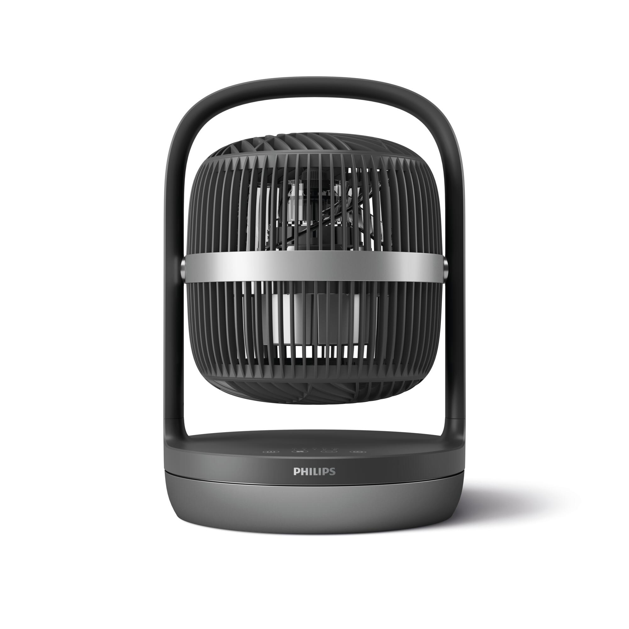 Ventilador negro con asa. Tiene una jaula y una base redonda. El fondo es blanco.