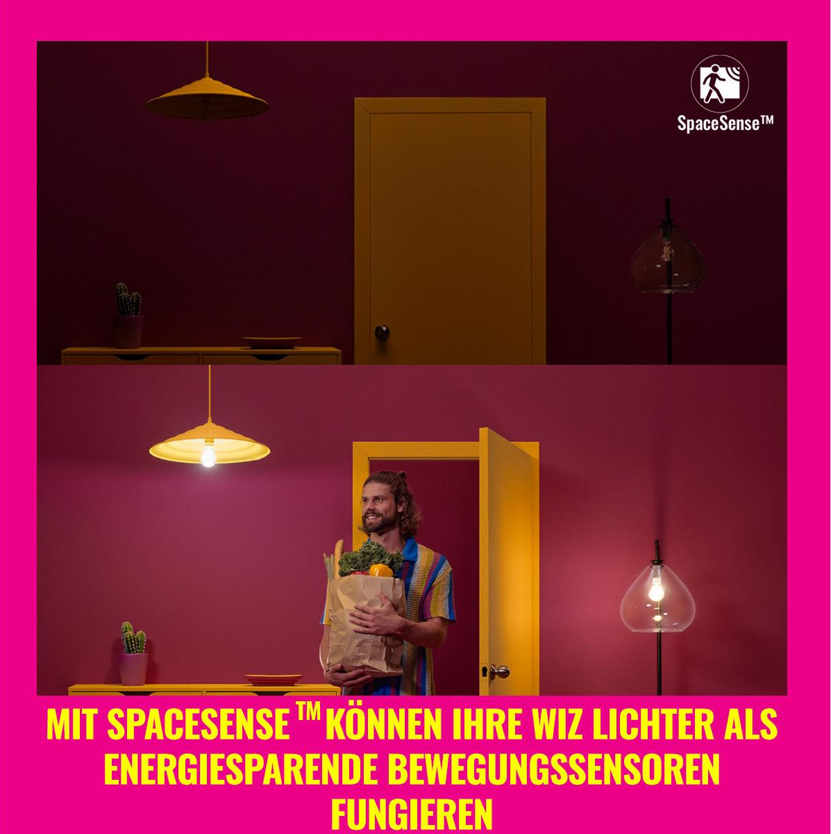Une pièce avec un homme tenant des courses. Le texte dit: 'Avec SpaceSense, vos lumières Wiz agissent comme des capteurs d'économie d'énergie'.