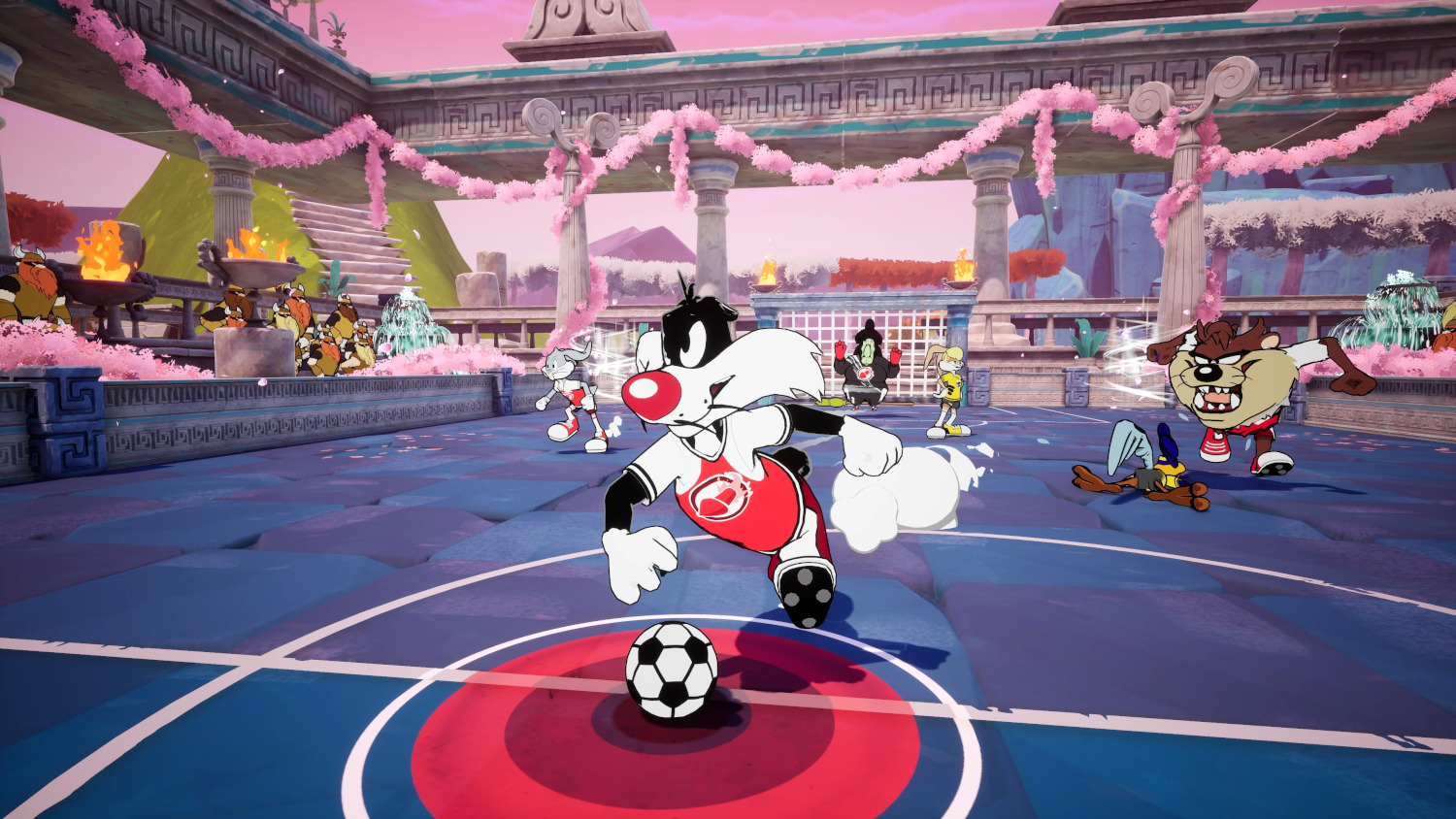 Sylvestre le chat jouant au football avec d'autres personnages de Looney Tunes.