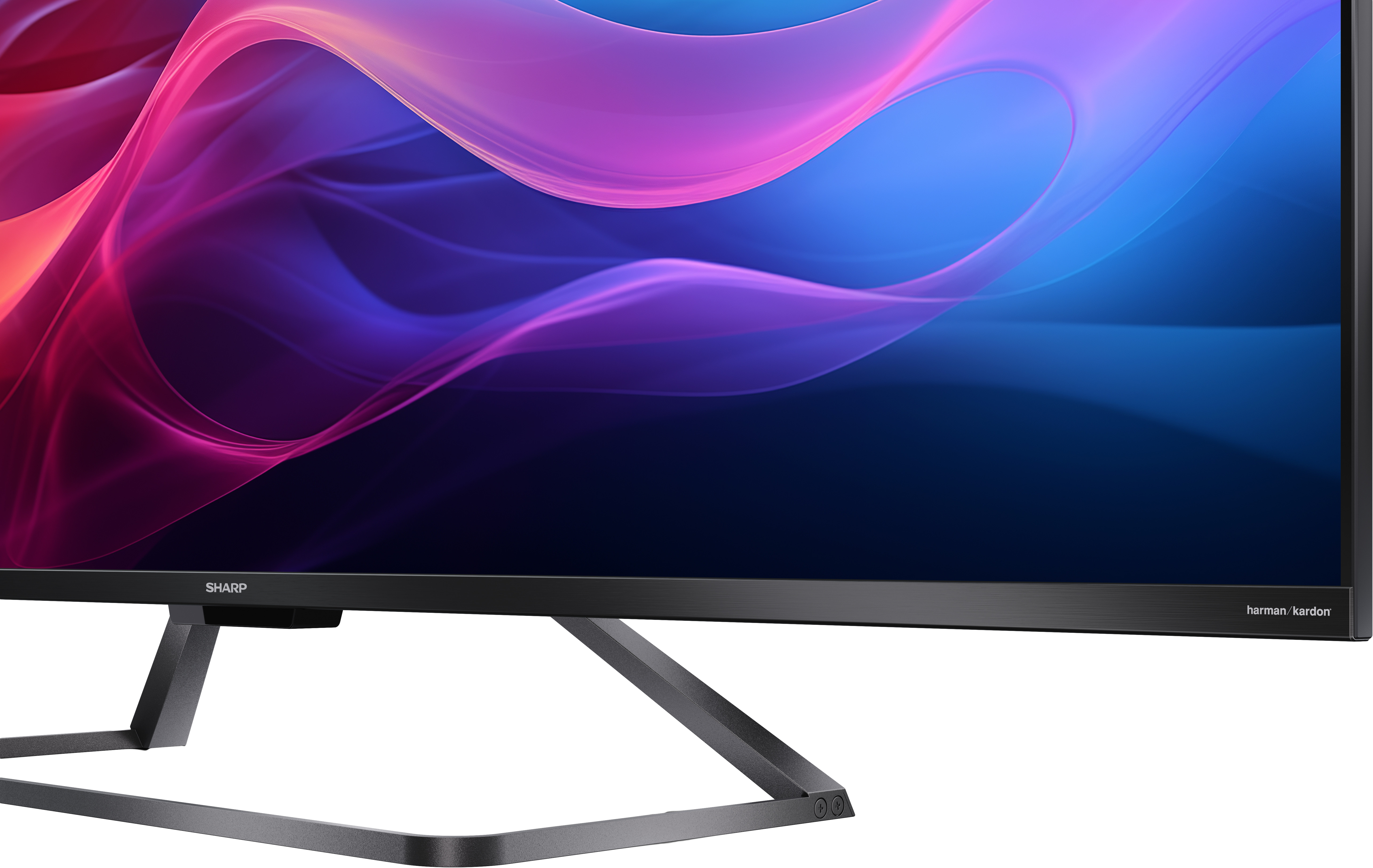 Egy számítógép monitor a Sharp és a Harman/Kardon logókkal.