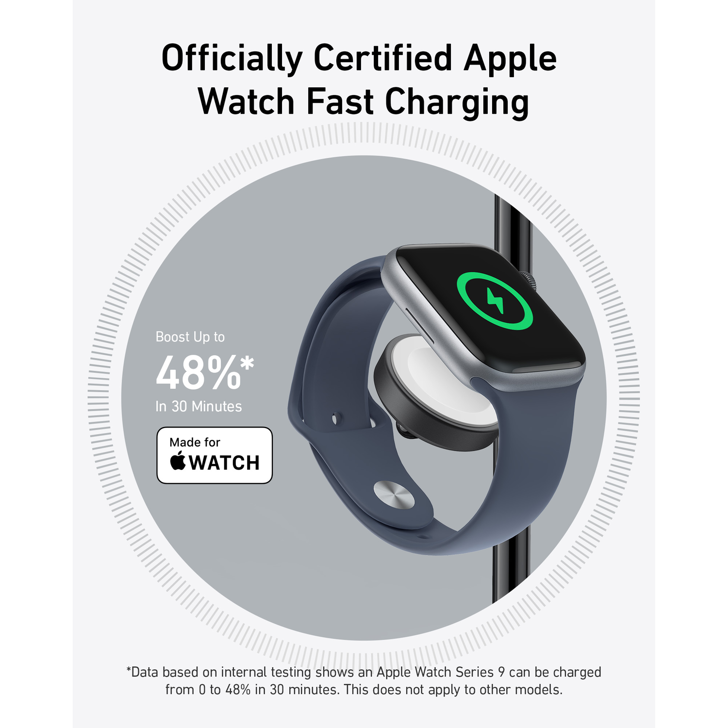 An Apple Watch with a dark blue band on a charging pad.