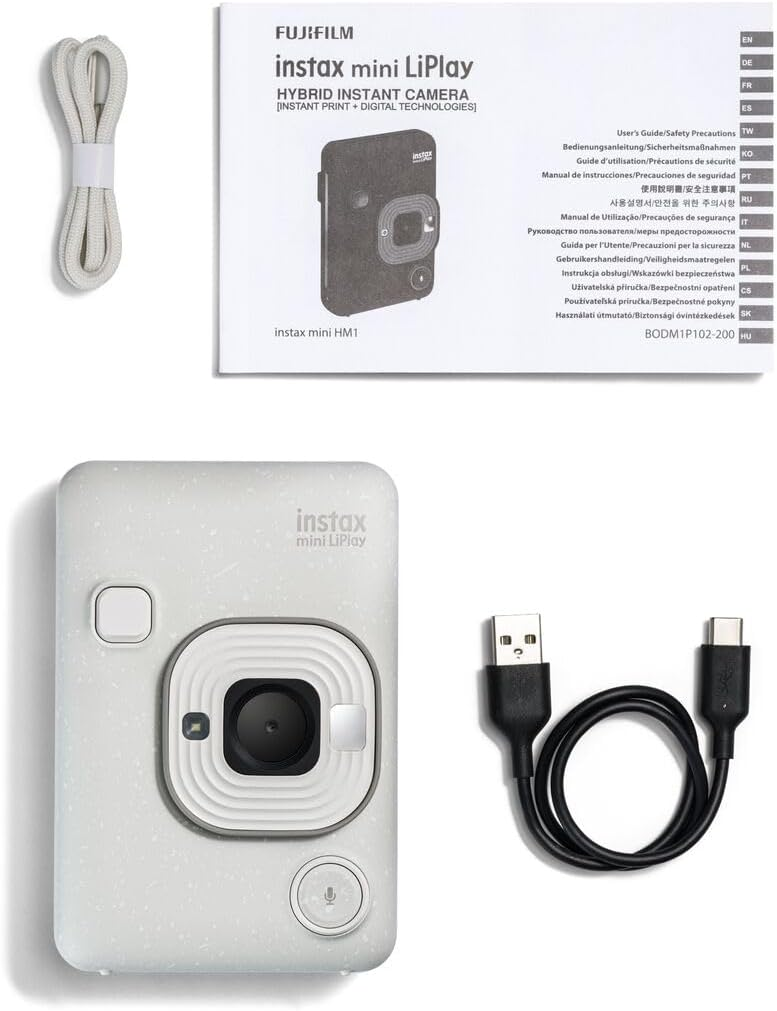 Kit de cámara Instax mini LiPlay con accesorios, incluyendo correa y cable.