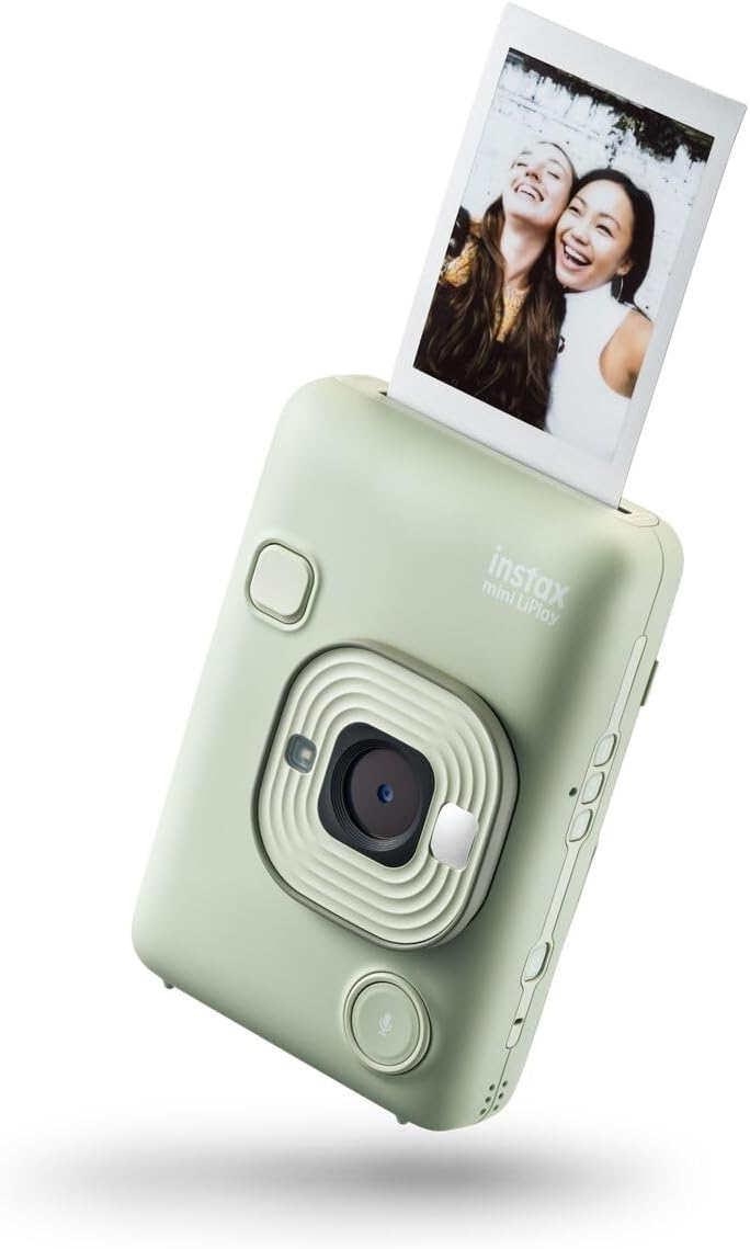 Cámara Instax mini LiPlay verde claro con foto de dos mujeres. Imagen se está imprimiendo.