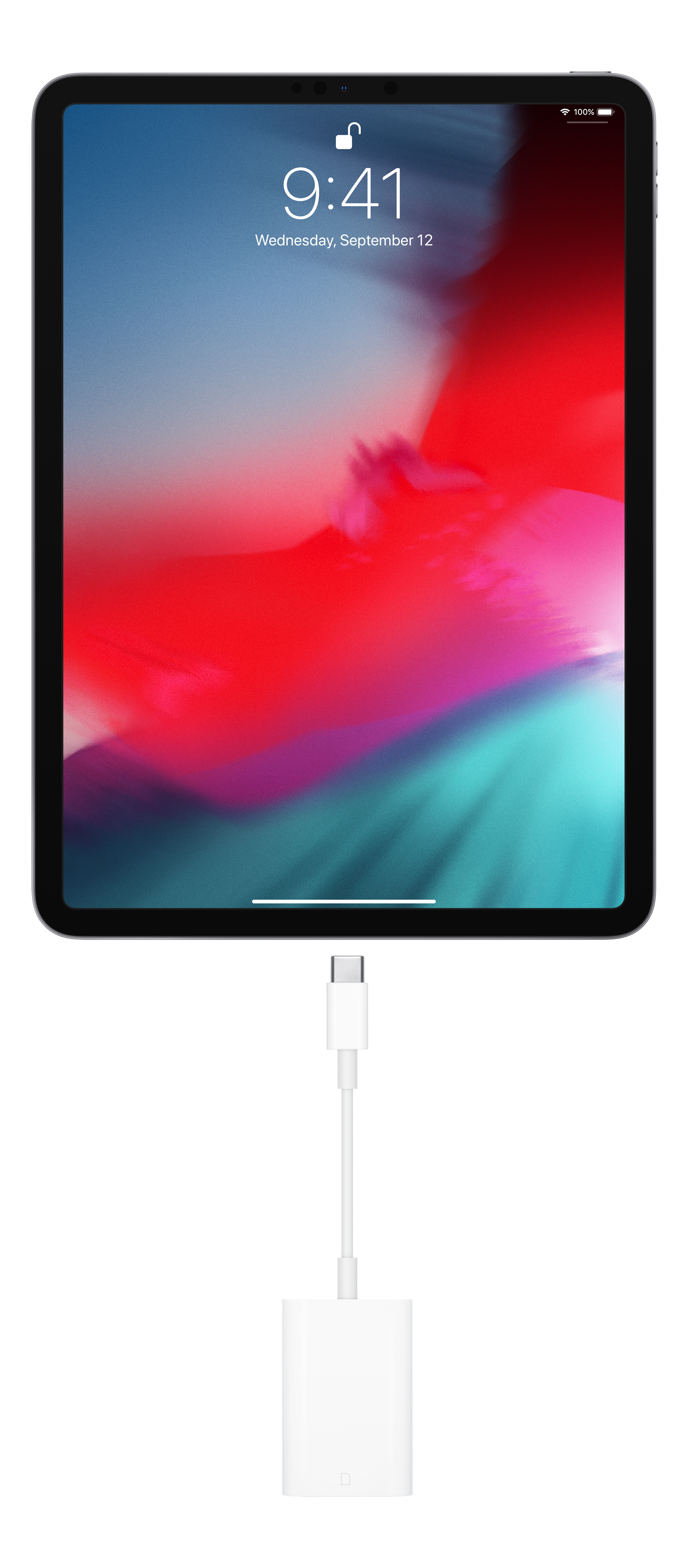 Un iPad con un cavo di ricarica collegato. Lo schermo mostra l'ora e la data e uno sfondo rosso e blu.