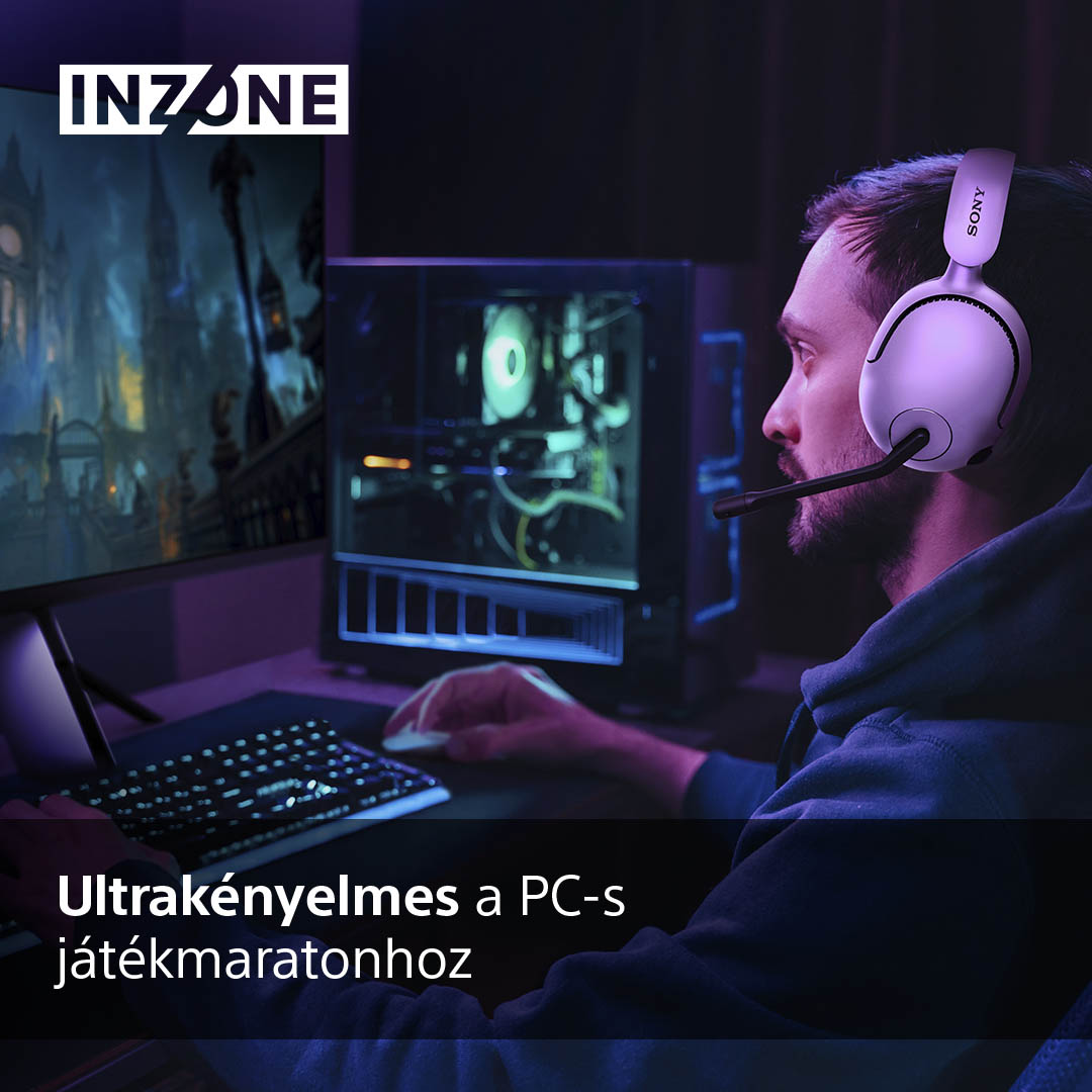 Egy férfi gamer headset-et visel, élénk színekkel teli képernyőt néz, miközben játszik.