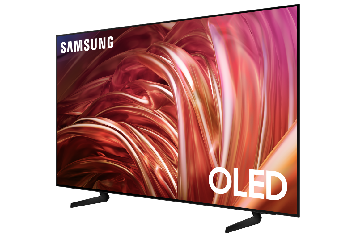 Samsung OLED TV, siyah çerçeve, siyah arka plan üzerinde. Ekranda kırmızı ve pembe soyut görüntü.