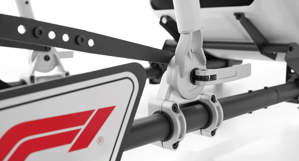 Close up of a Formula 1 car part with the F1 logo and a mechanism.