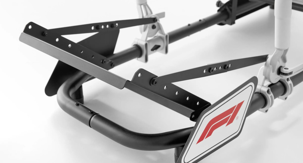 Black and silver F1 racing simulator frame with F1 logo on a white background.