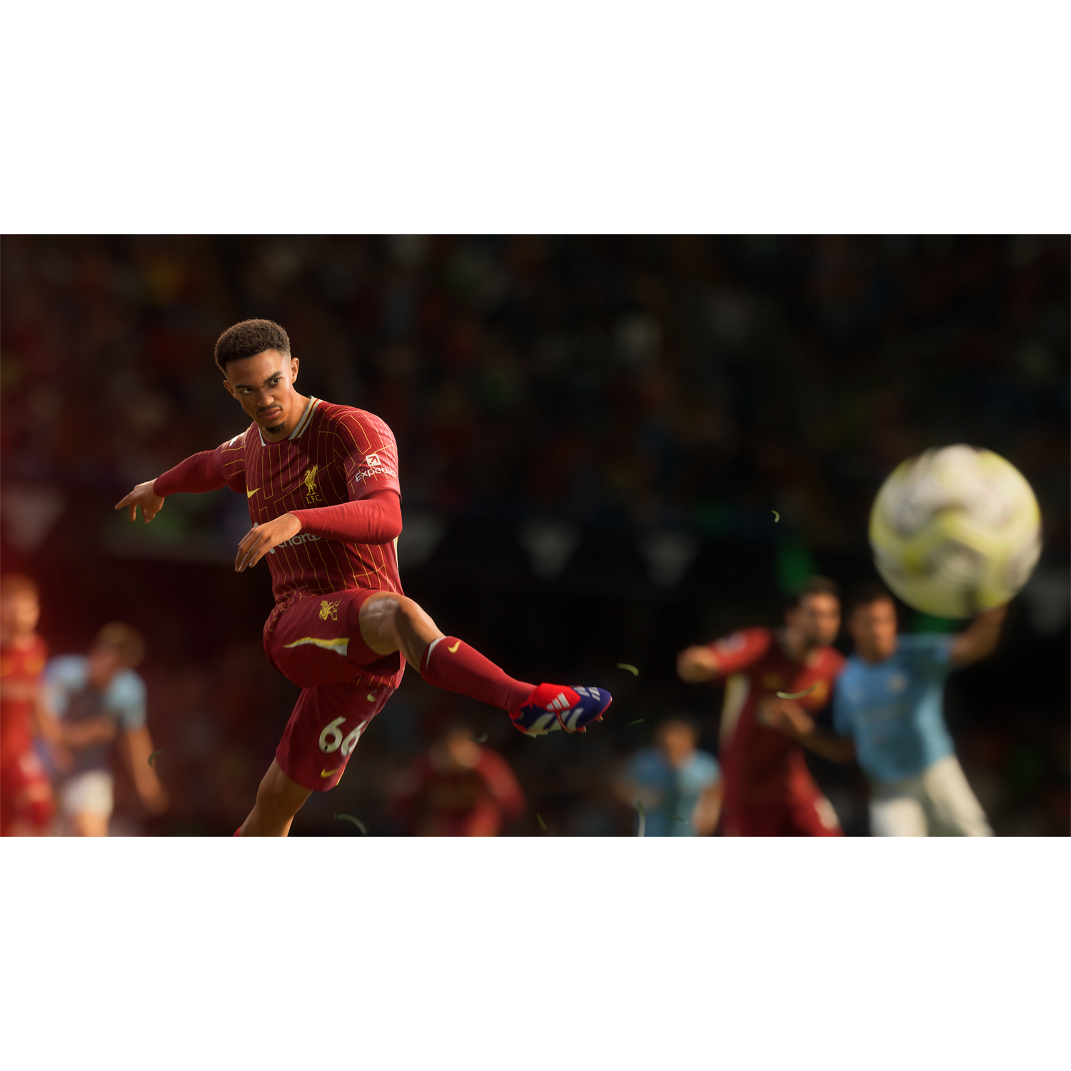 Un calciatore calcia un pallone. Stadio sullo sfondo. Giocatore in maglia rossa e pantaloncini bianchi.