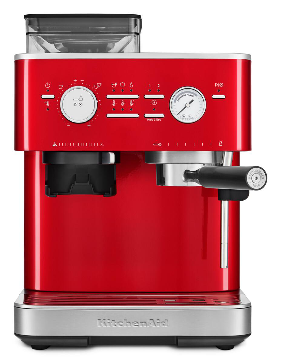 Rote Espressomaschine mit Knöpfen, Mühle und Ausguss. Silberner Sockel und schwarzer Griff.