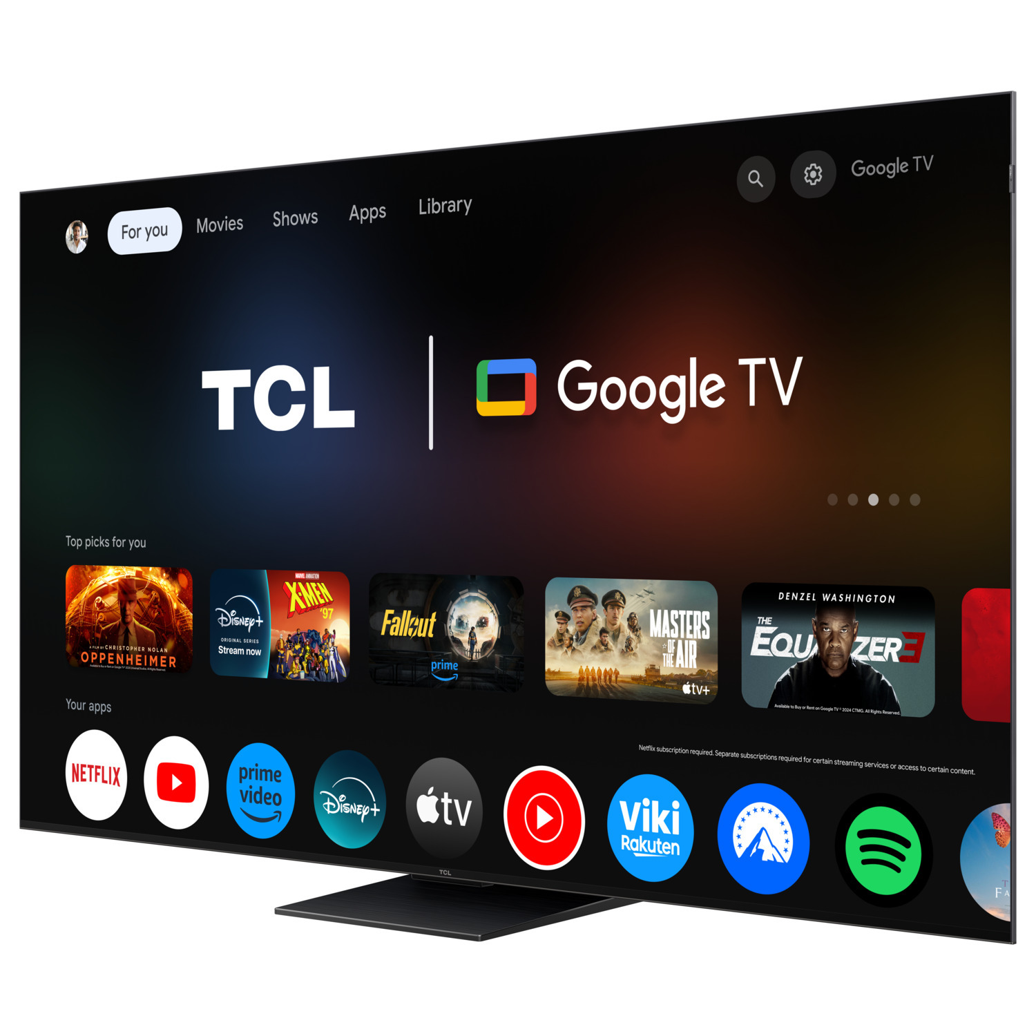 Grand écran TCL Google TV avec plusieurs applications et films affichés. Base noire et fond blanc.