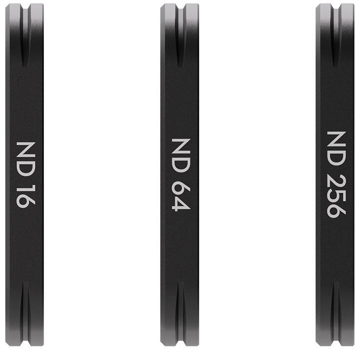 Trzy czarne filtry ND. Każdy filtr ma zapisaną inną wartość ND.