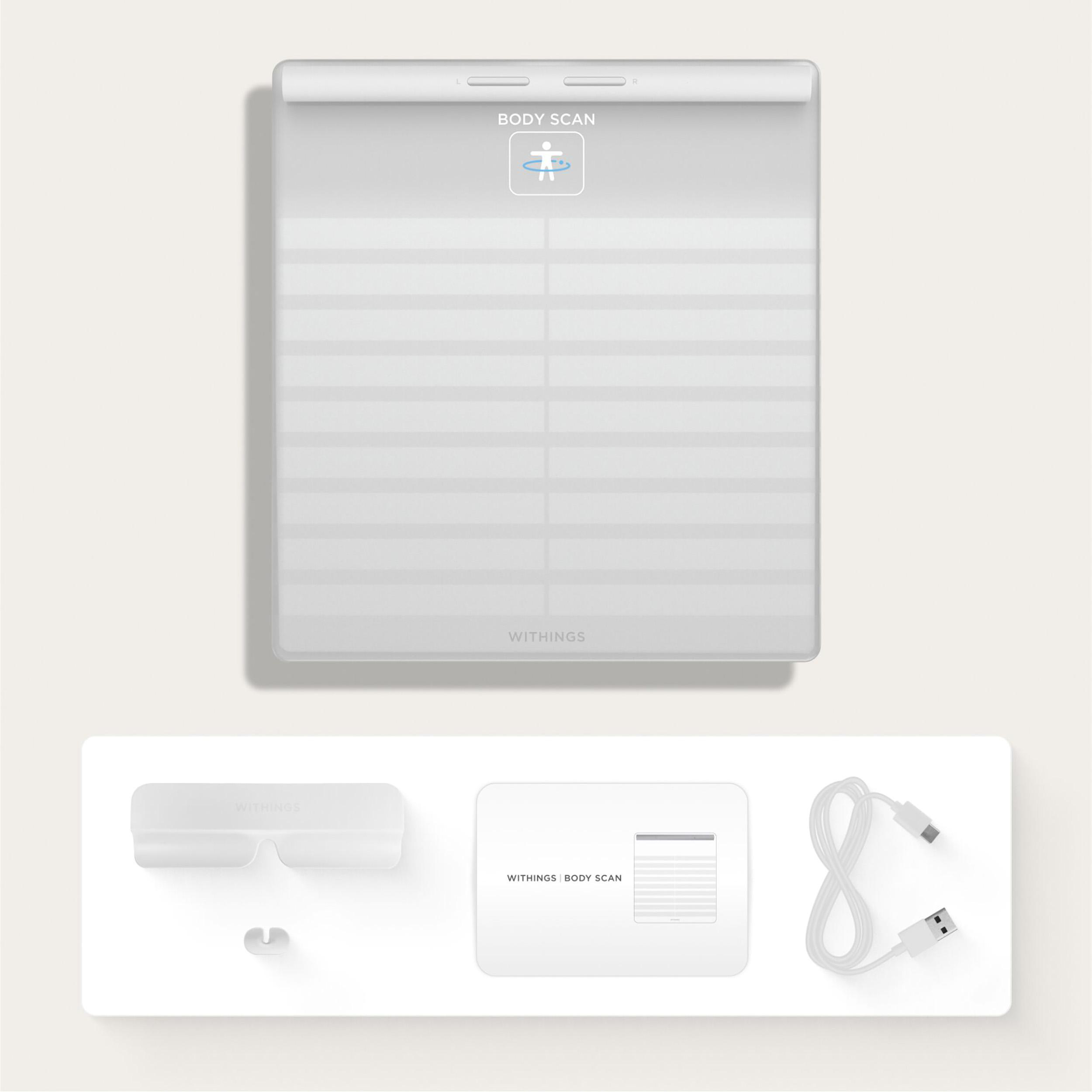 Weiße Withings Body Scan Waage und Zubehör, darunter ein USB-Kabel und Anweisungen.