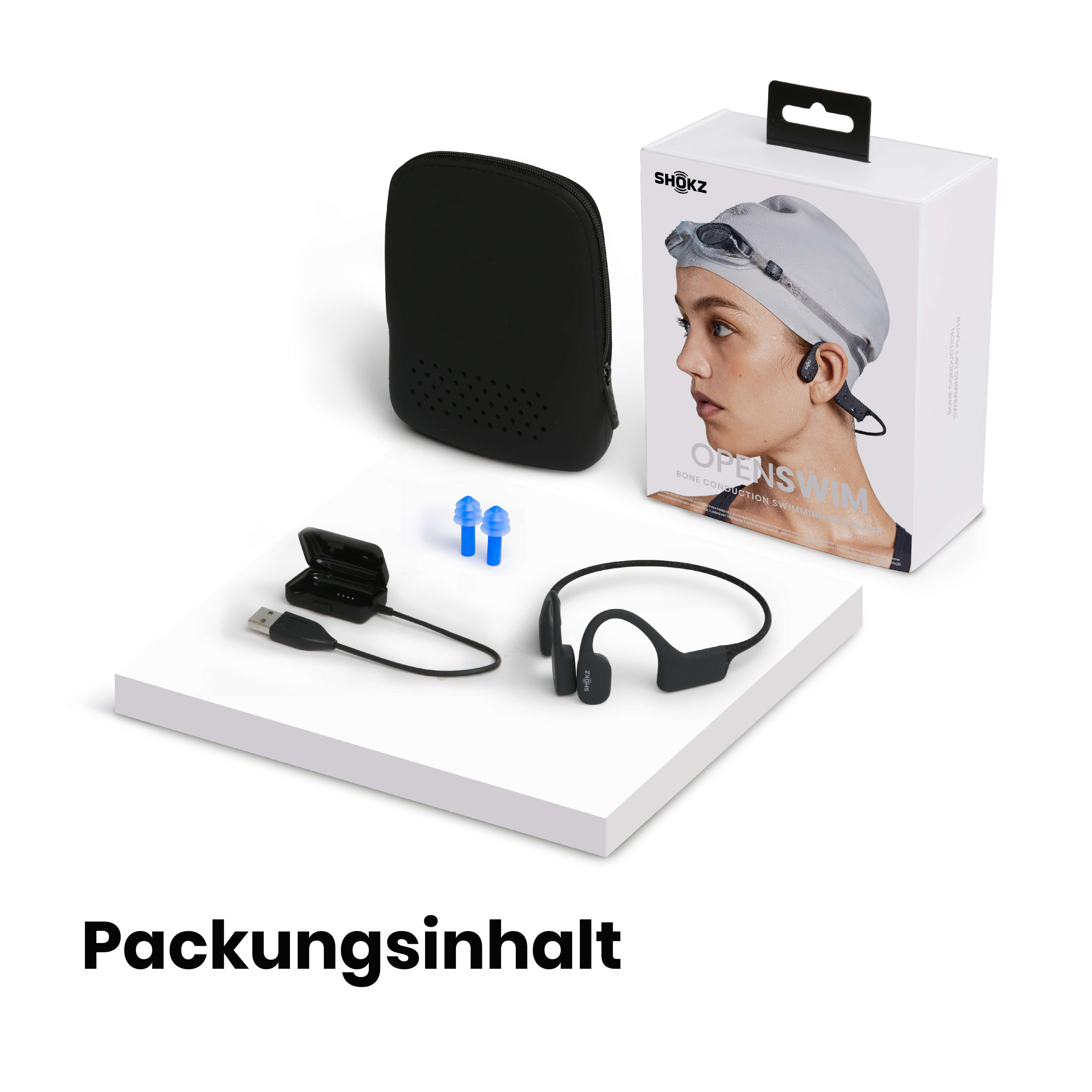 Packungsinhalt: Kopfhörer, Etui, Ohrstöpsel, Ladegerät und eine Box mit einer Frau mit Badekappe und Brille.