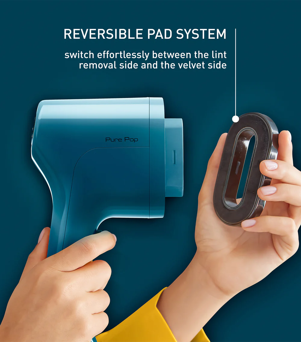 Siyah bir pedli tüy toplayıcı. Metin: Reversible Pad System.