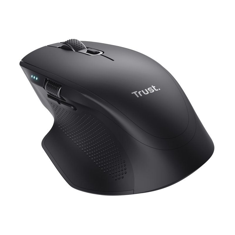 Ratón inalámbrico negro ergonómico con botones y rueda. La marca Trust es visible en el ratón.