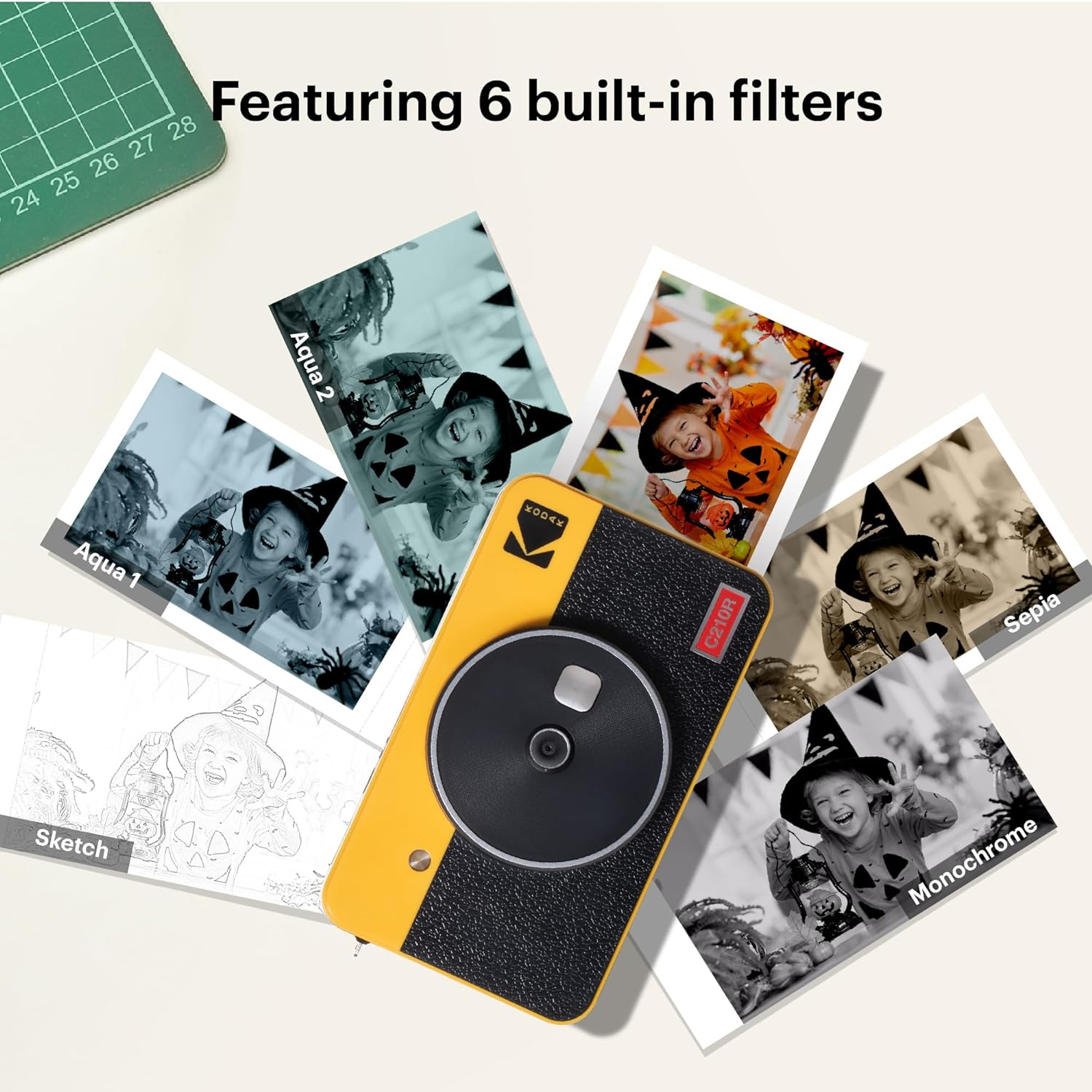 A yellow and black retro camera with several small photos on a table, showing different filters.