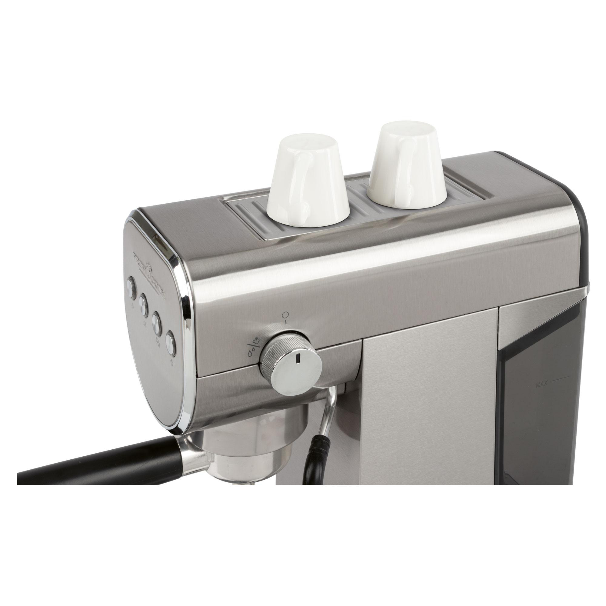 Nahaufnahme einer silbernen Espressomaschine mit zwei weißen Tassen oben drauf. Die Maschine hat Knöpfe und einen Drehregler.