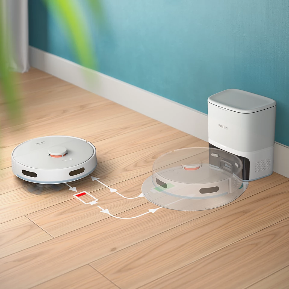 Robot porszívó töltés és takarítás közben. A bázis jobbra van, a porszívó kerek.