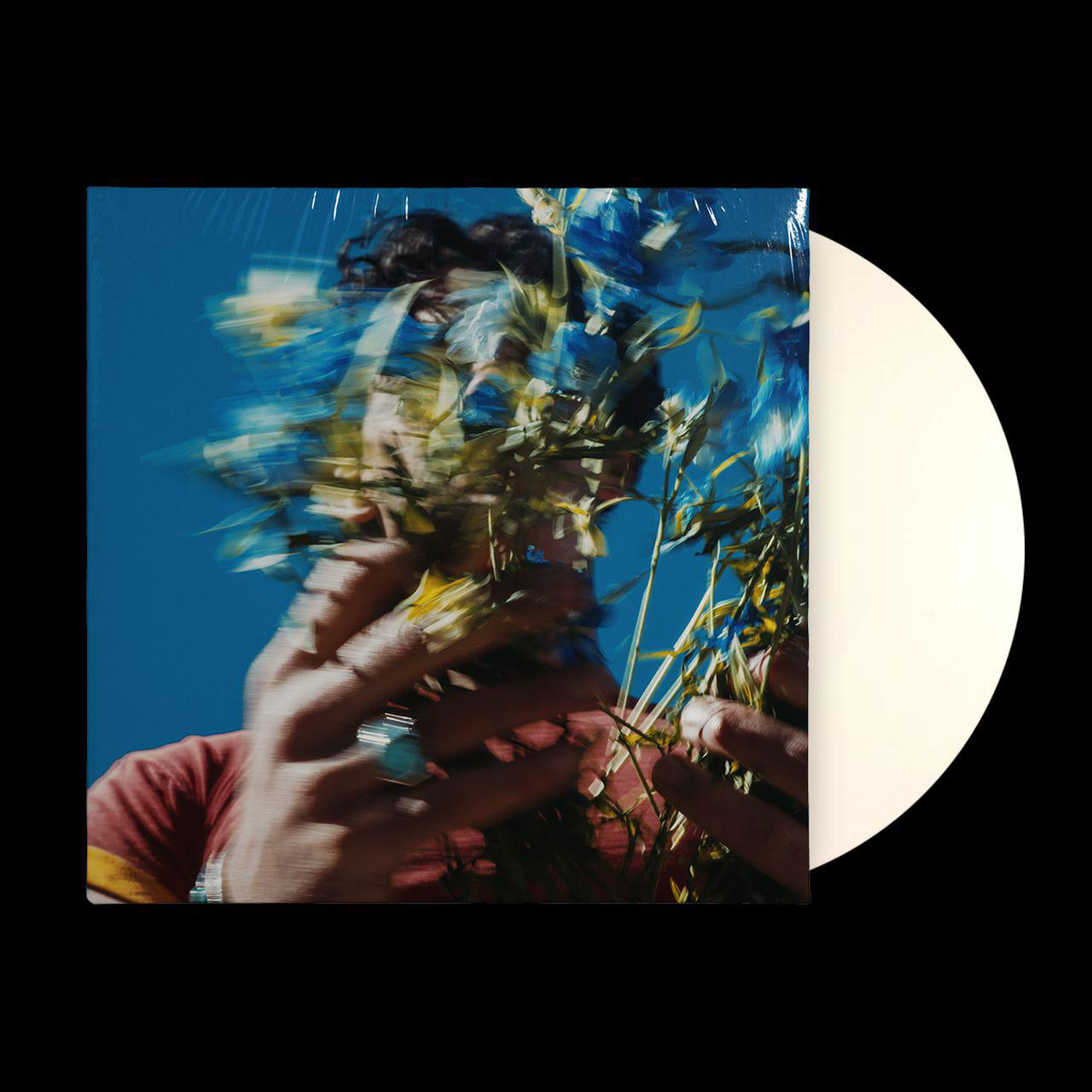 Albumcover mit Blumen, die das Gesicht einer Person verdecken, eine weiße Schallplatte rechts.