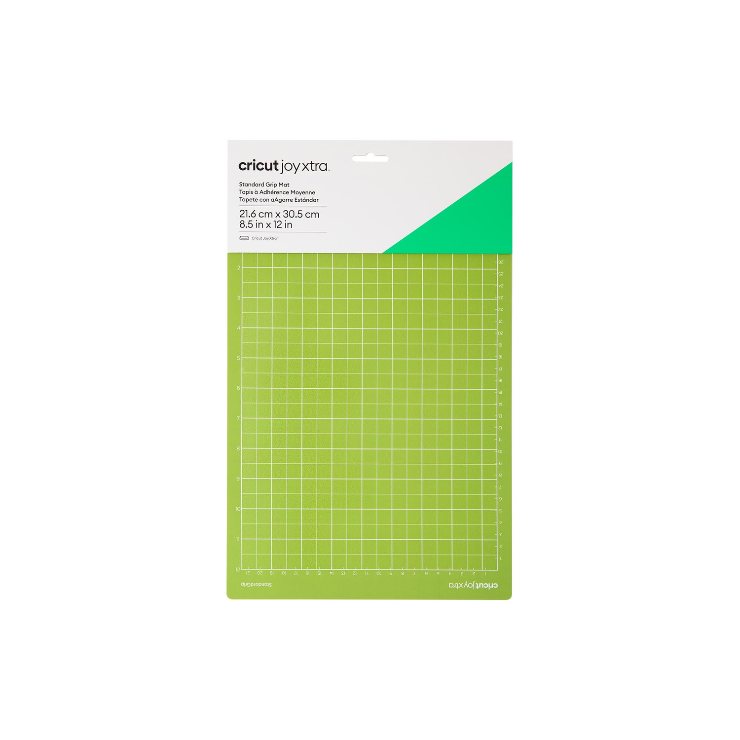 Groene snijmat met rasterlijnen, een witte bovenkant en een groene driehoek. Cricut Joy Xtra.