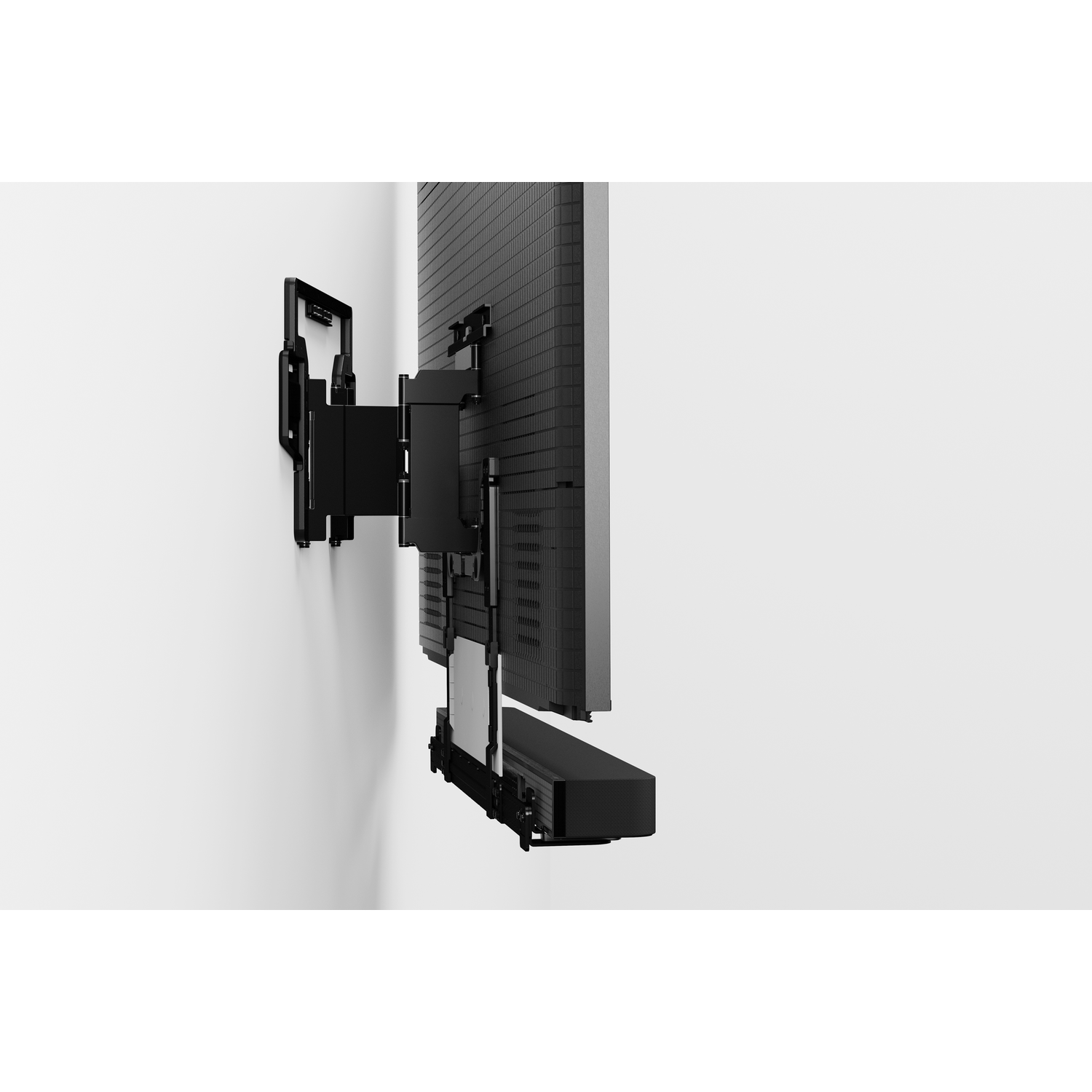 Een gemonteerde tv op een witte muur met een soundbar eronder.
