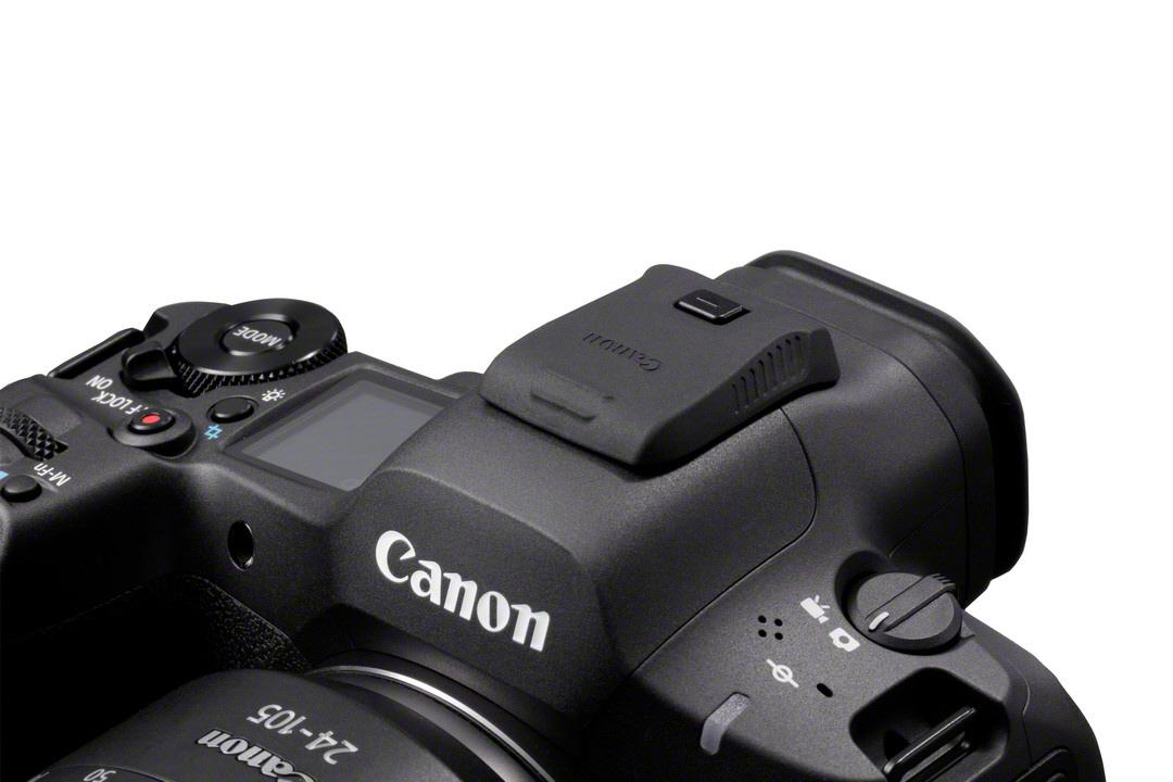 Canon Kamera, Draufsicht. Schwarzes Gehäuse, weißes Canon-Logo, Knöpfe und eine Pop-up-Blitzabdeckung.