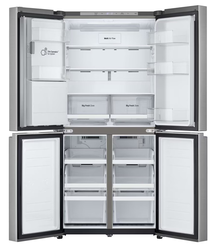 Otwarta lodówka ze stali nierdzewnej z wieloma półkami i szufladami.