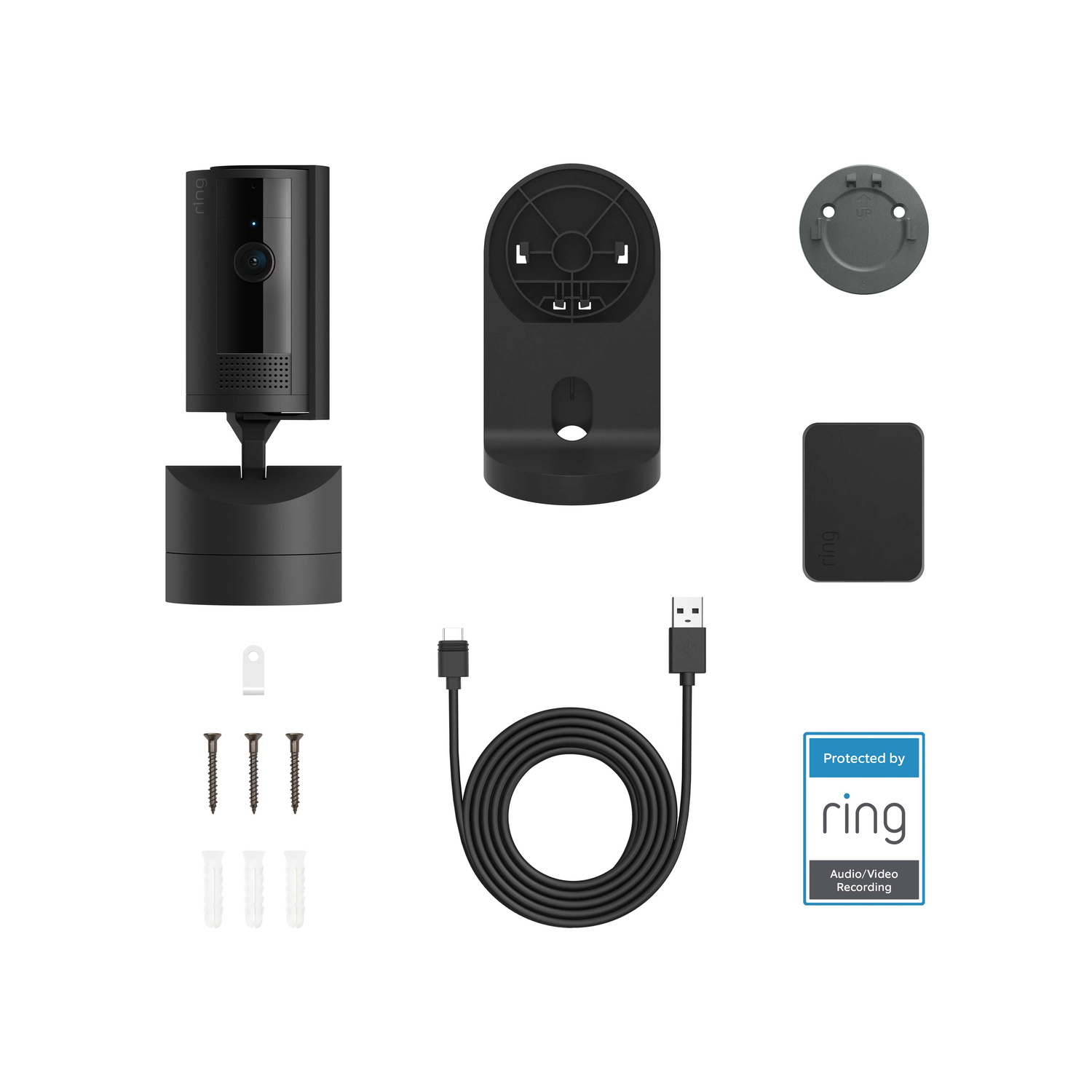 Ring security camera parts: camera, base, mounting hardware, USB cable, and a Ring sticker.