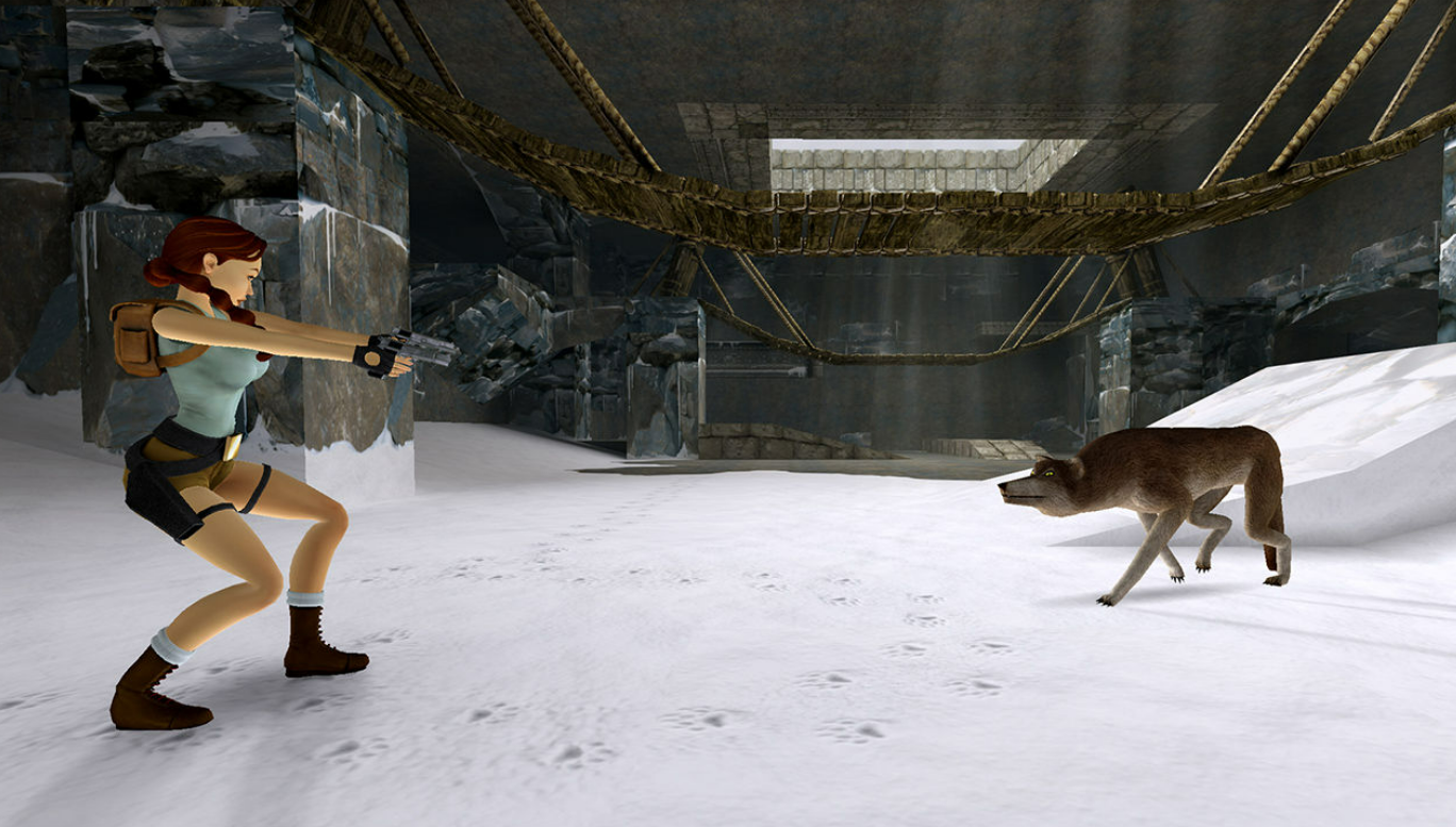 Lara Croft in einer verschneiten Umgebung, die eine Waffe auf einen Wolf richtet.