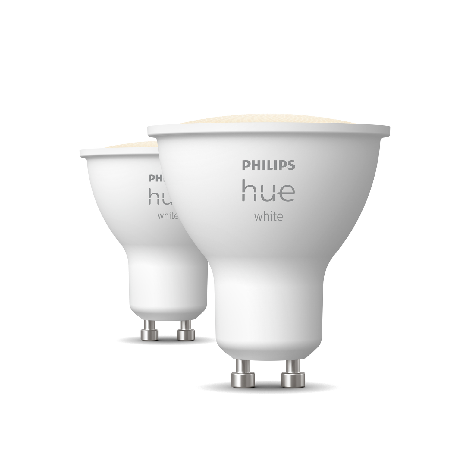 Two Philips Hue white smart bulbs on a white background, close up shot.