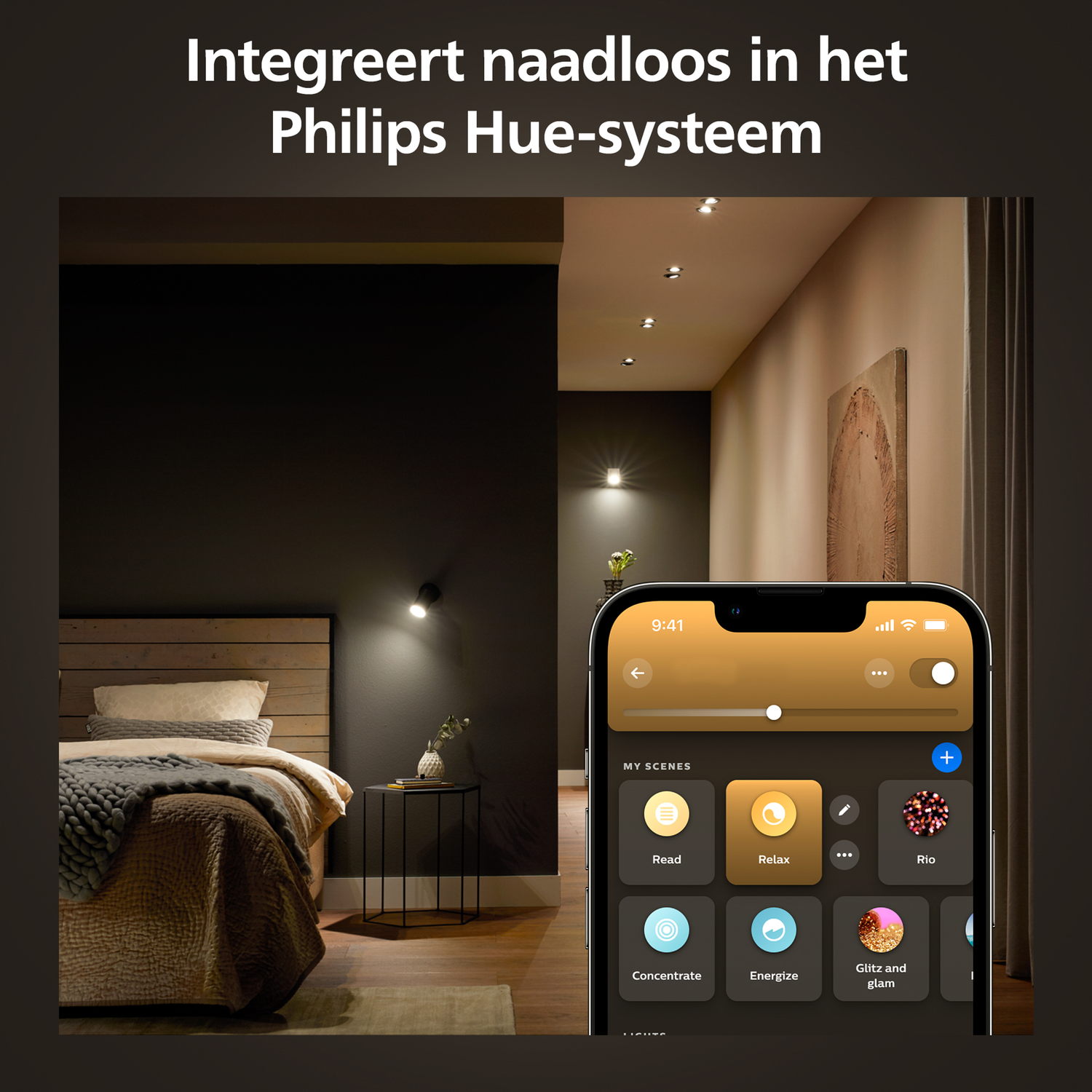A phone displaying a smart home app is in a bedroom. Lights are on, controlled by the app.