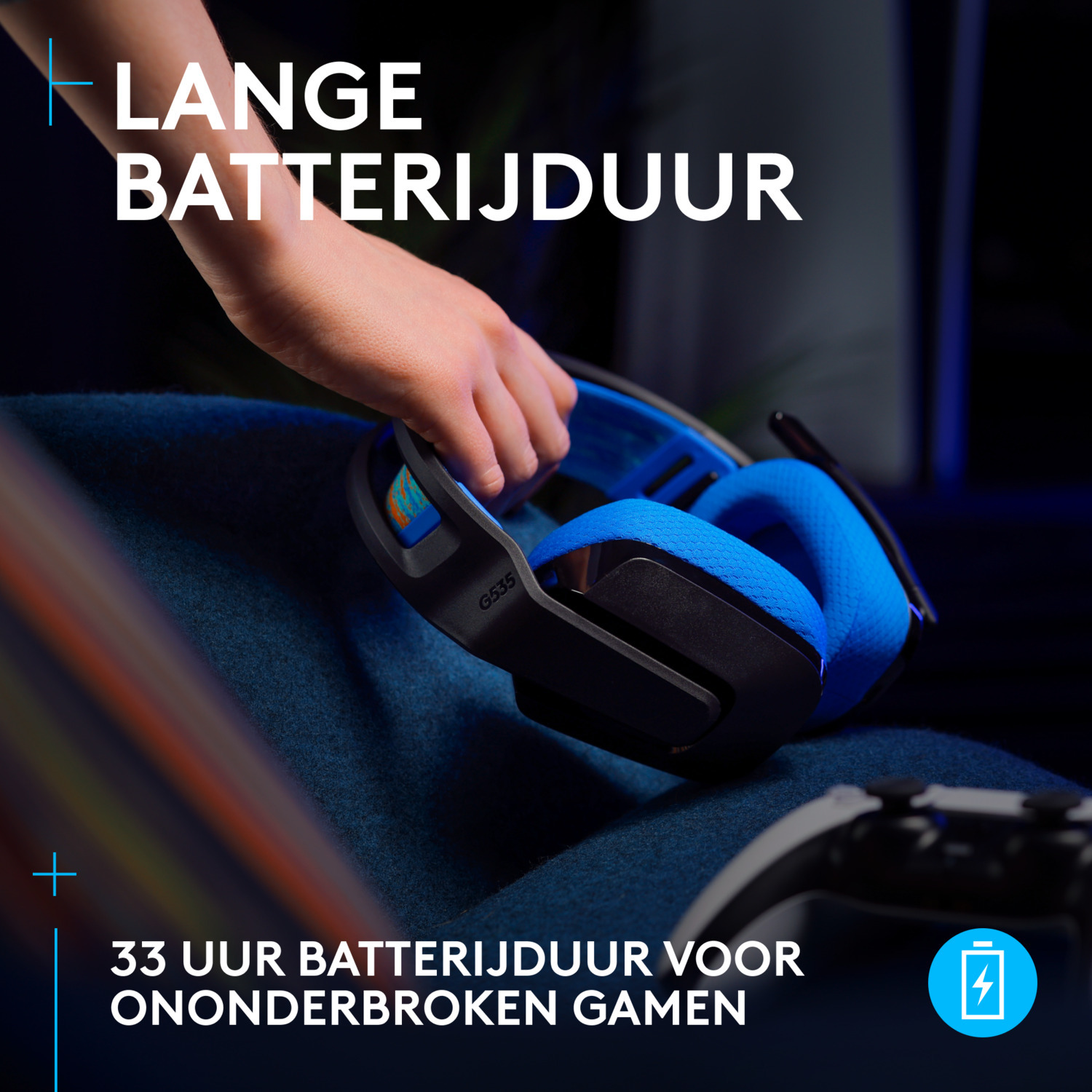 A person holding blue headphones with text about battery life.