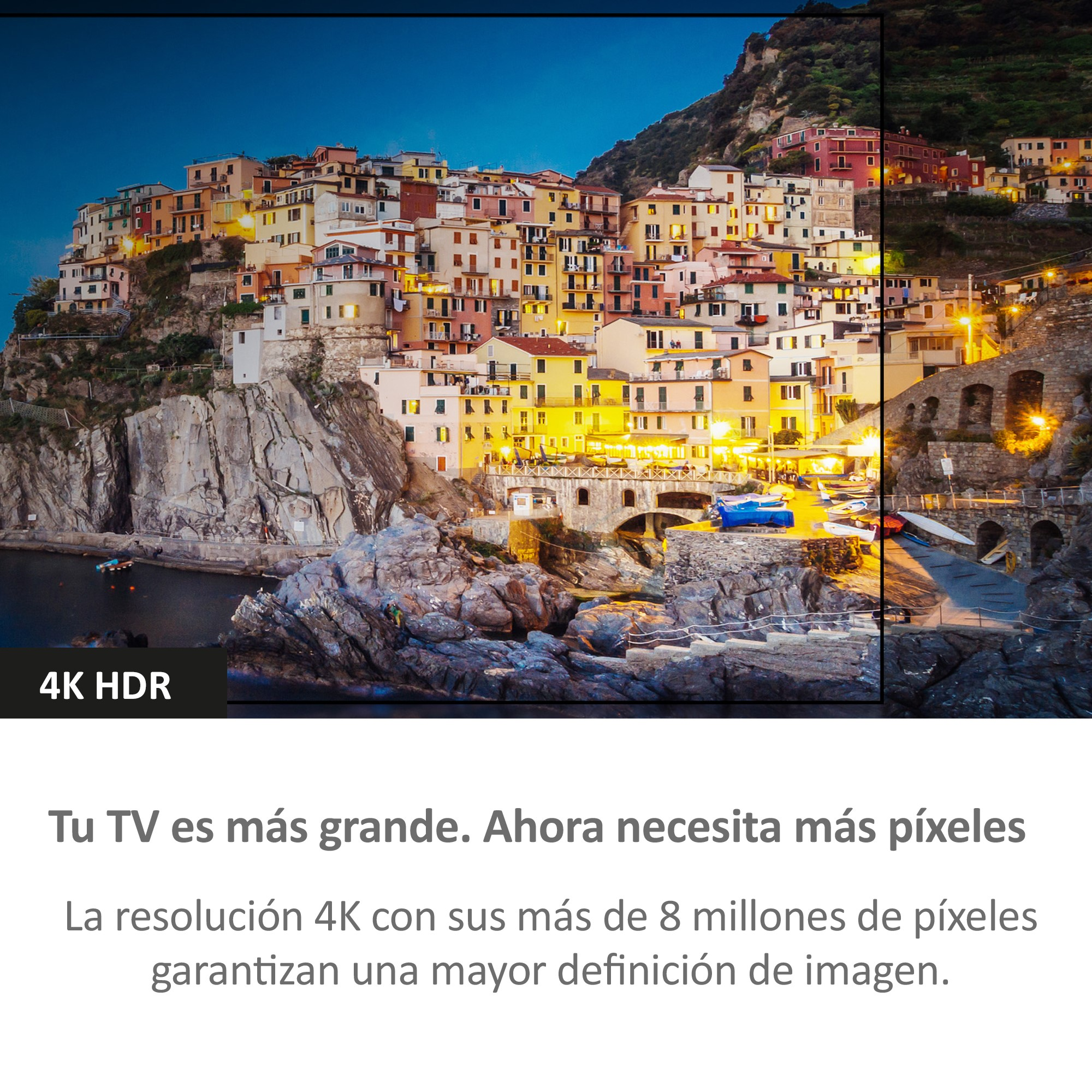 Una vista panorámica de un pueblo junto al mar, iluminado con luces, y una etiqueta 4K HDR.