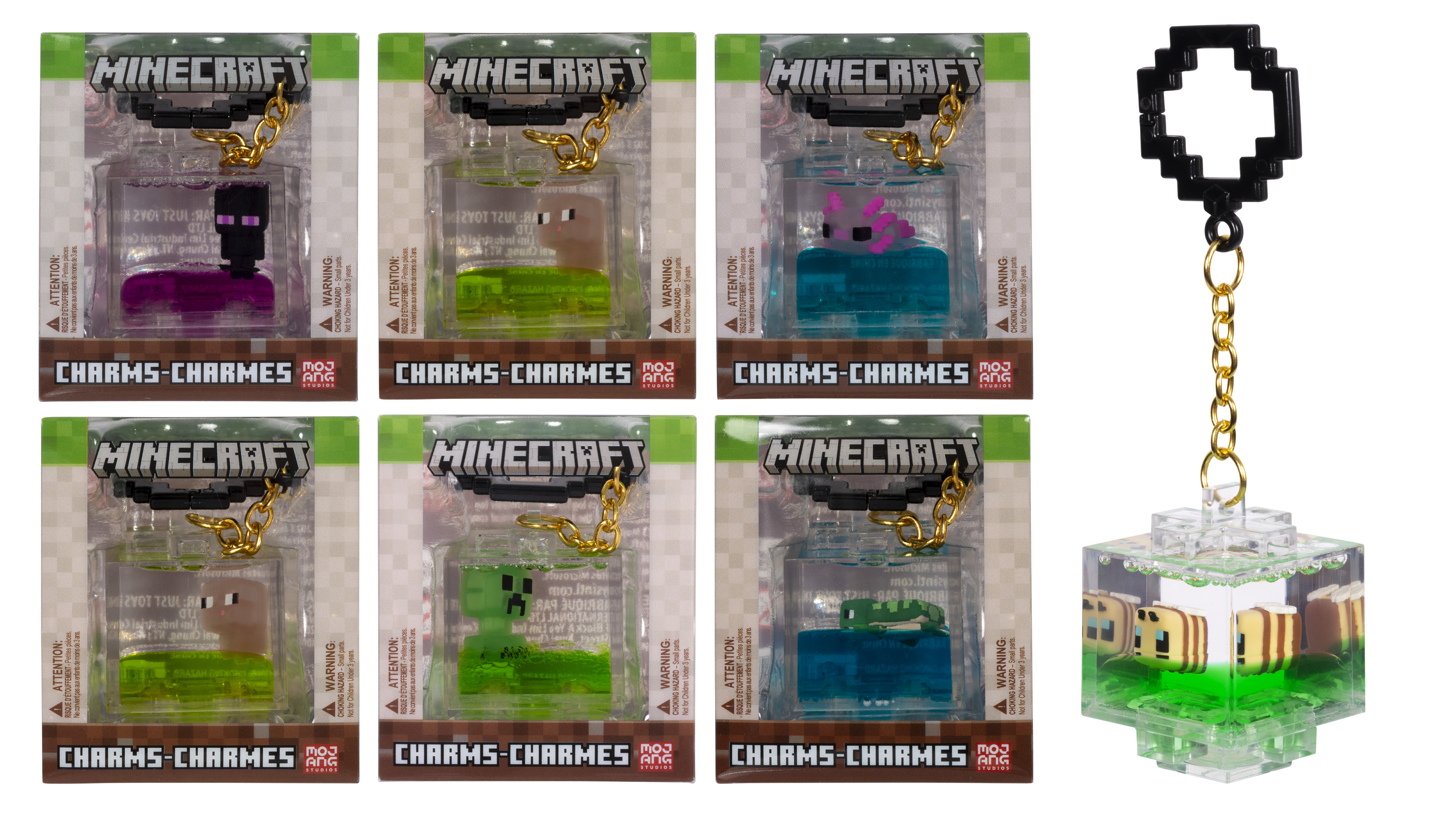 Sechs Minecraft-Anhänger in Verpackung und einer lose. Die Anhänger sind Charaktere in transparenten Boxen.